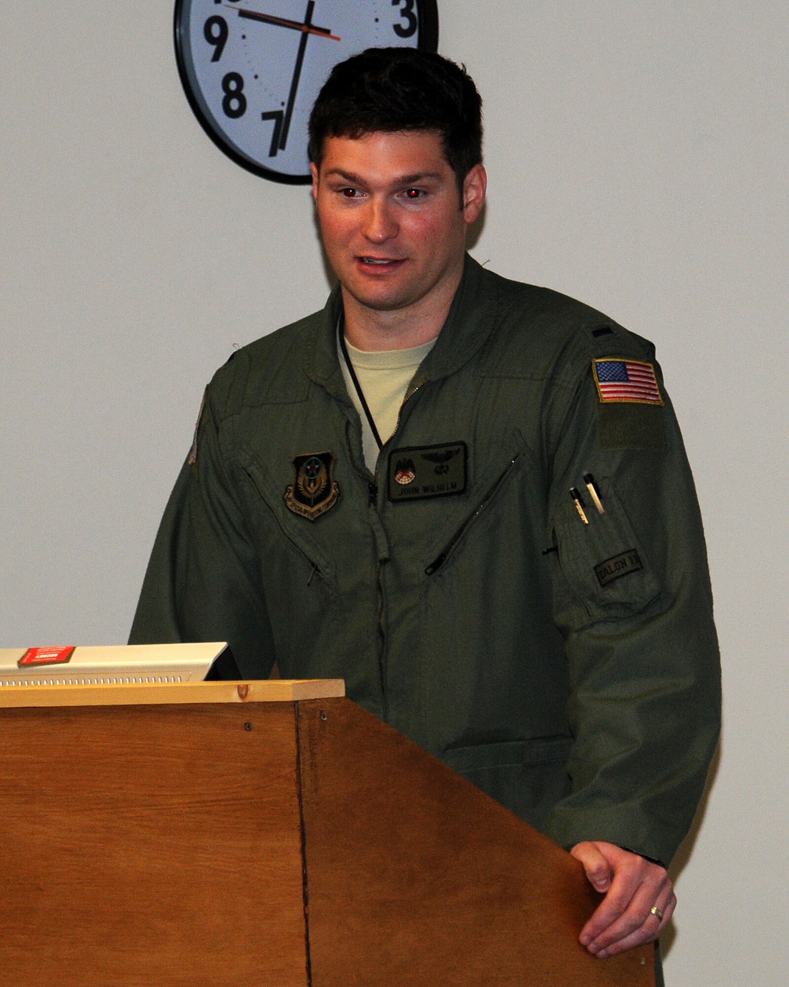 1st Lt. John Wilhelm, 7th Special Operations Squadron pilot from White Hall, Md., speaks about his experiences and what it takes to become a pilot April 19, 2013, at RAF Mildenhall, England. As part of Job Shadow Day, Wilhelm spoke to children about trying hard in school in order to be accepted into college. (U.S. Air Force photo by Gina Randall/Released)
