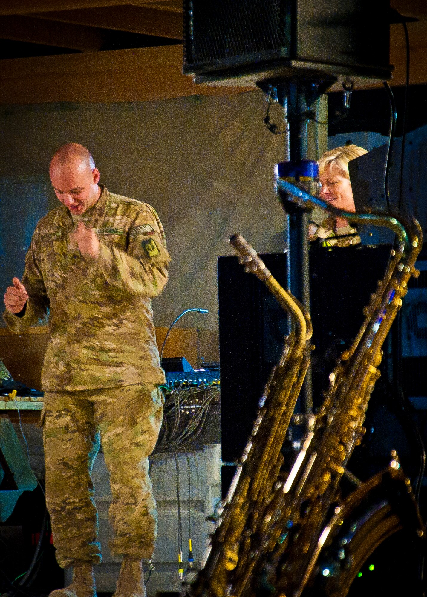 U.S. and Coalition servicemember’s cheer for the Air Force Central Command Band “Vector” as they perform on The Boardwalk at Kandahar Airfield, Afghanistan, April 16, 2013. (U.S. Air Force photo/Senior Airman Scott Saldukas)