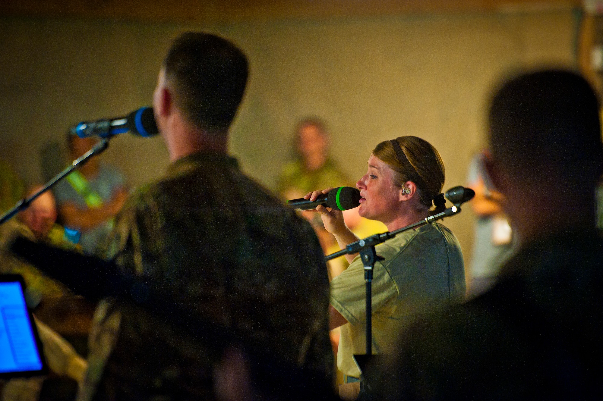 Tech. Sgt. Paige Martin, Air Force Central Command Band “Vector” vocalist, performs on The Boardwalk at Kandahar Airfield, Afghanistan, April 16, 2013. (U.S. Air Force photo/Senior Airman Scott Saldukas)