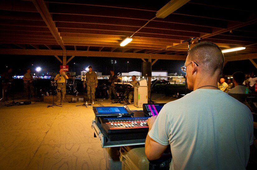 U.S. Air Force Master Sgt. Mark Hannah, Air Force Central Command Band “Vector” audio engineer, perform on The Boardwalk at Kandahar Airfield, Afghanistan, April 16, 2013. (U.S. Air Force photo/Senior Airman Scott Saldukas)