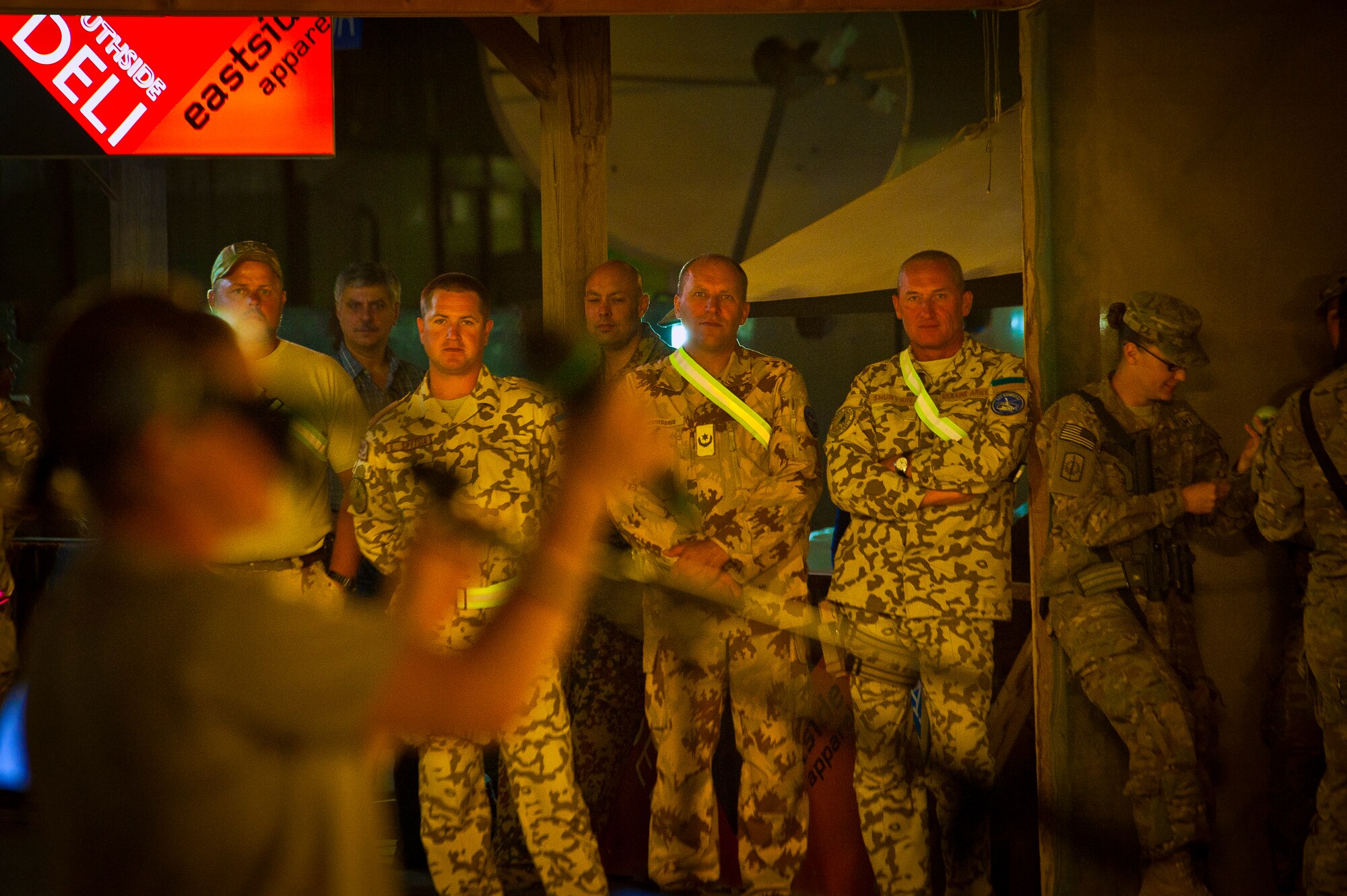U.S. and Coalition servicemember’s cheer for the Air Force Central Command Band “Vector” as they perform on The Boardwalk at Kandahar Airfield, Afghanistan, April 16, 2013. (U.S. Air Force photo/Senior Airman Scott Saldukas)