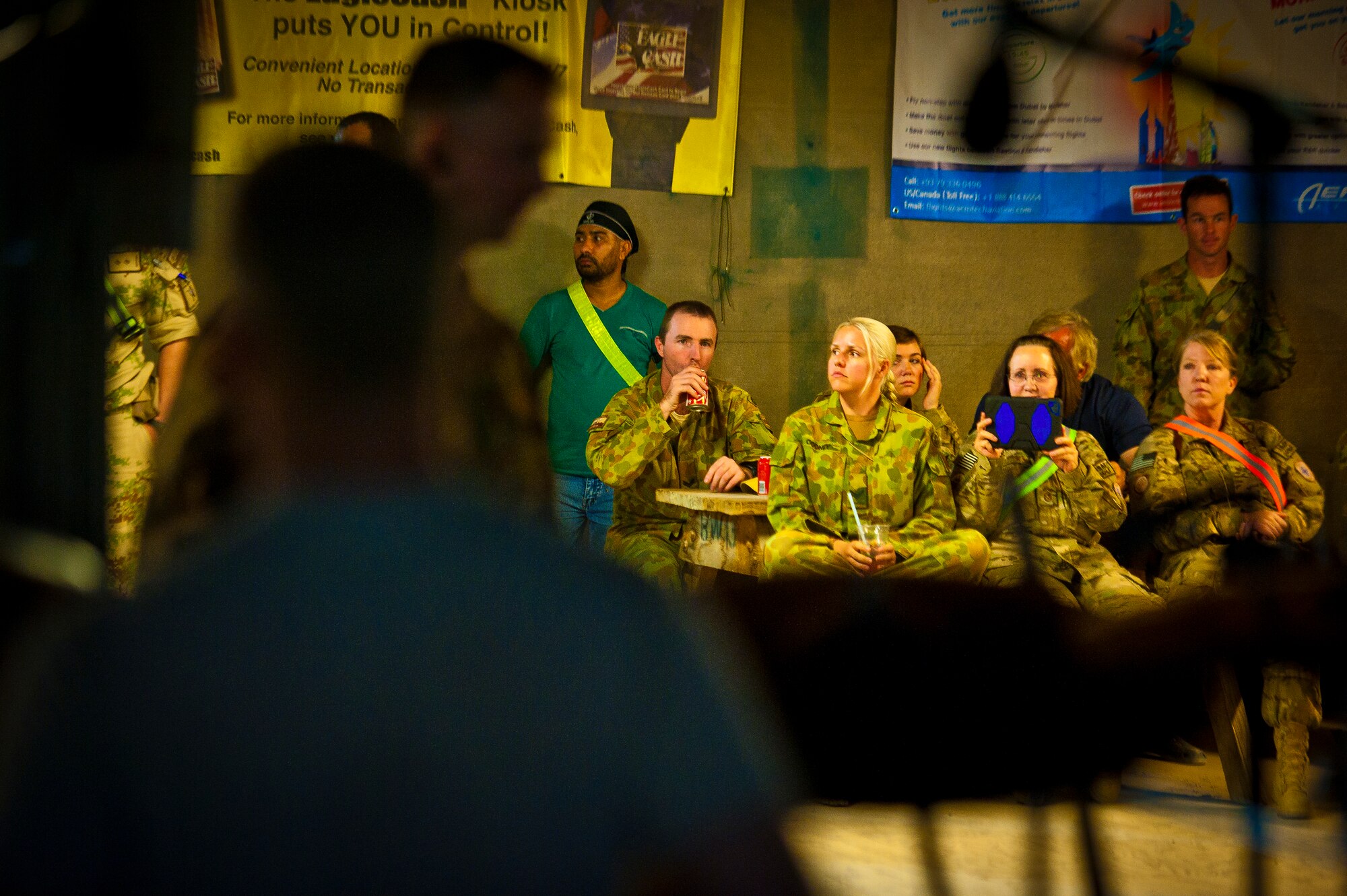 U.S. and Coalition servicemember’s cheer for the Air Force Central Command Band “Vector” as they perform on The Boardwalk at Kandahar Airfield, Afghanistan, April 16, 2013. (U.S. Air Force photo/Senior Airman Scott Saldukas)