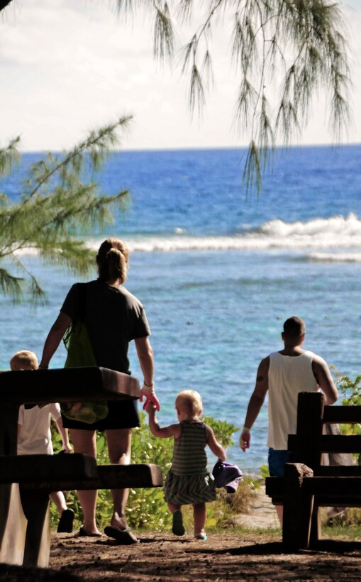 Volunteers walk to the beach during the Earth Day cleanup on Tarague Beach at Andersen Air Force Base, Guam, April 21, 2013. Earth Day is an international event demonstrating concern and active support for the environment.  Earth Day represents the commitment and significant investment the United States and countries around the world have made toward environmental security. (U.S. Air Force photo by Airman 1st Class Marianique Santos/Released)