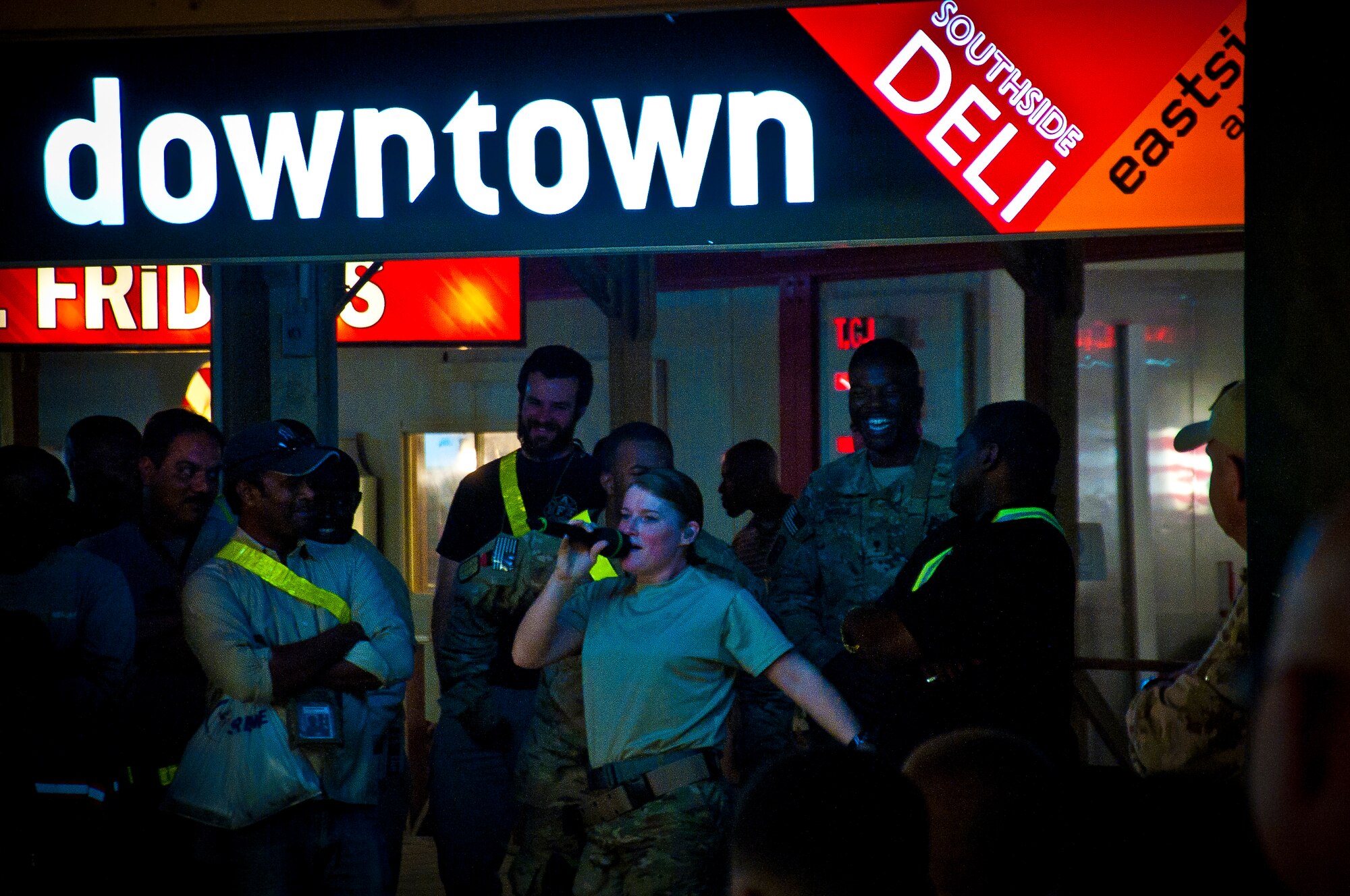 Tech. Sgt. Paige Martin, Air Force Central Command Band “Vector” vocalist, performs on The Boardwalk at Kandahar Airfield, Afghanistan, April 16, 2013. (U.S. Air Force photo/Senior Airman Scott Saldukas)