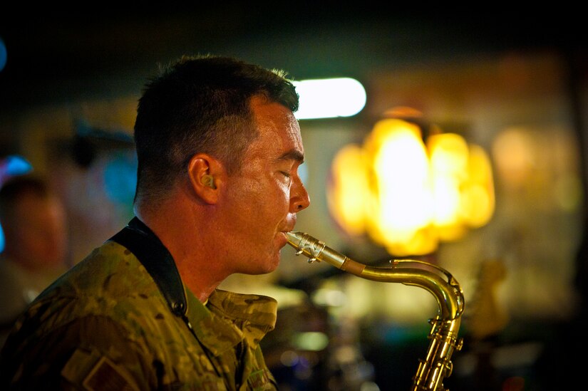 Master Sgt. Jake McCray, Air Force Central Command Band “Vector” saxophonist, performs on The Boardwalk at Kandahar Airfield, Afghanistan, April 16, 2013. (U.S. Air Force photo/Senior Airman Scott Saldukas)