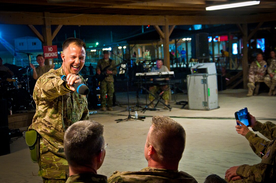 Tech. Sgt. Paige Martin, Air Force Central Command Band “Vector” vocalist, performs on The Boardwalk at Kandahar Airfield, Afghanistan, April 16, 2013. (U.S. Air Force photo/Senior Airman Scott Saldukas)