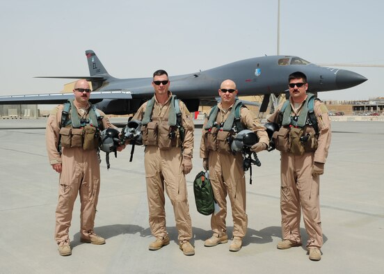 SOUTHWEST ASIA - Members from the 34th Expeditionary Bomb Squadron prepare to fly American flags to honor the 71st anniversary of the Doolittle Raid, April 18. (U.S. Air Force photo/Master Sgt. Brendan Kavanaugh)