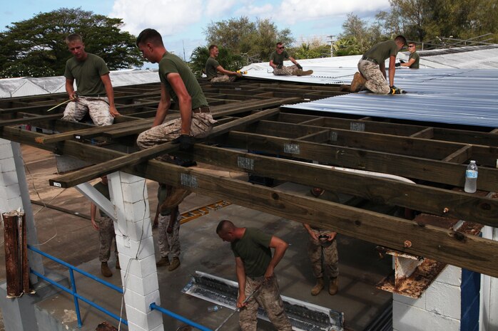 Marines repair a stage at Marcial A. Sublan Elementary School April 18 during Exercise Guahan Shield.  Guahan Shield facilitated multiservice engagements, set conditions for bilateral and multilateral training opportunities, and supported rapid response to potential theater crises and contingency operations in the Asia-Pacific region.  The Marines are part of Combat Logistics Detachment 39, 9th Engineer Support Battalion, 3rd Marine Logistics Group, III Marine Expeditionary Force.  
