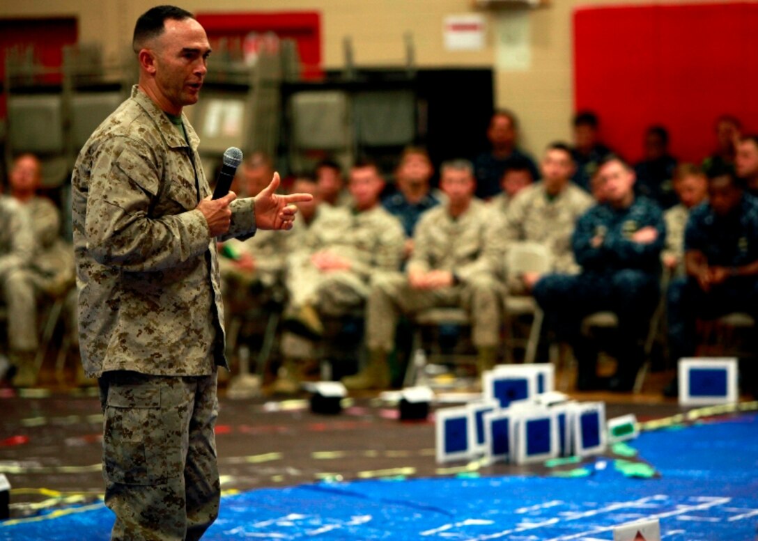 Brig. Gen. John K. Love, commanding general of 2d Marine Expeditionary Brigade, briefs his commander's intent to Marines, Sailors and coalition partners at a rehearsal of concept drill for Bold Alligator 2013 at Camp Allen, Norfolk, Va., April 19. Bold Alligator 13 is a synthetic, scenario-driven exercise designed to train staffs primarily from 2d Marine Expeditionary Brigade and Expeditionary Strike Group 2 in an effort to continue revitalizing and improving their ability to integrate and execute large-scale operations from the sea. "This exercise offers us a tremendous opportunity to increase our amphibious proficiency at a level beyond how our routinely deployed forces operate," said Love.