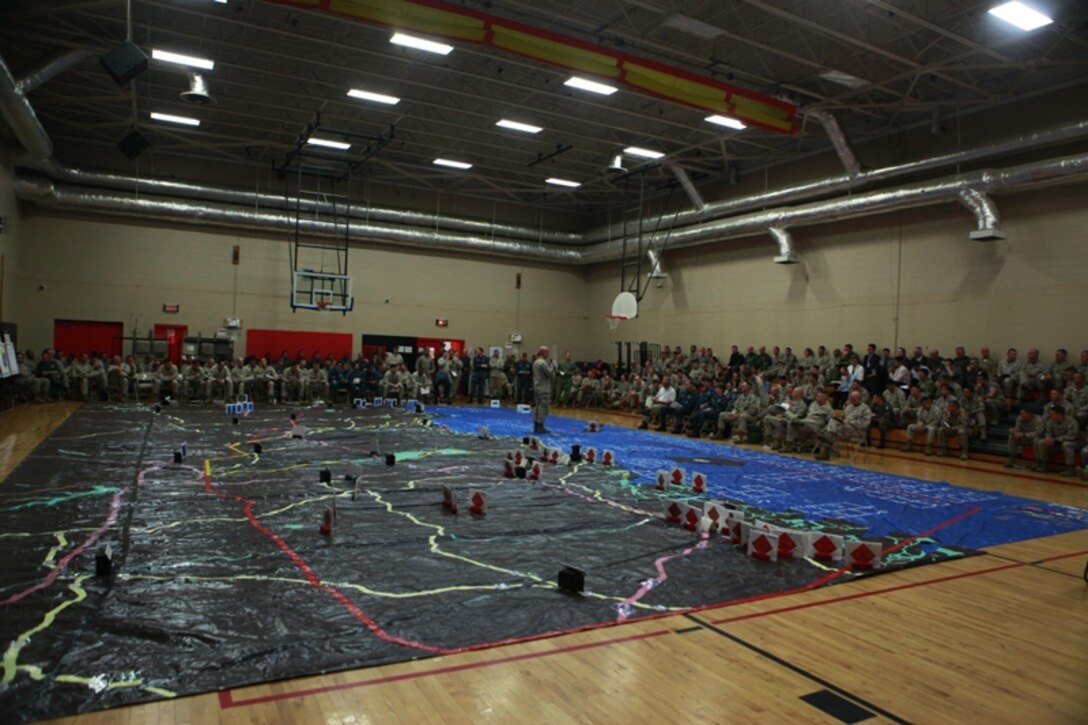 Marines, Sailors and coalition partners gather for a rehearsal of concept drill to go through the landing plan and follow-on operations of a Marine Expeditionary Brigade-sized operation during Bold Alligator 2013 at Camp Allen, Norfolk, Va., April 19. Bold Alligator 13 is a synthetic, scenario-driven exercise designed to train staffs primarily from 2d Marine Expeditionary Brigade and Expeditionary Strike Group 2 in an effort to continue revitalizing and improving their ability to integrate and execute large-scale operations from the sea.