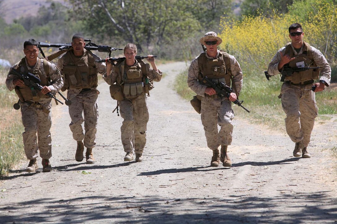 Marines with 1st Law Enforcement Battalion, crosses the finish line during a challenge course for the sixth event in the I Marine Expeditionary Force Commander's Cup tournament at Camp Pendleton, Calif., April 18. The Commander's Cup consists of seven challenges over the course of seven months. The final challenge will take place next month, where the winning battalion will be announced.