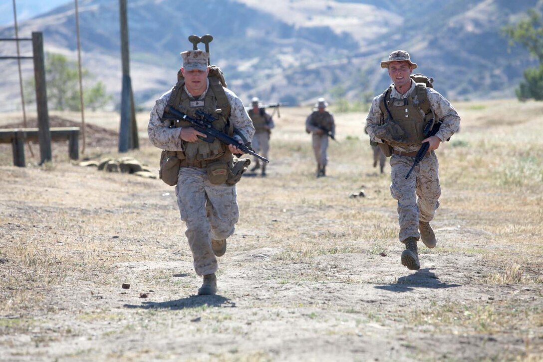 Marines with 1st Law Enforcement Battalion, sprint to the second challenge during the I Marine Expeditionary Force Commander's Cup event at Camp Pendleton, Calif., April 18. The Commander's Cup consists of seven challenges over the course of seven months. The final challenge will take place next month, where the winning battalion will be announced.
