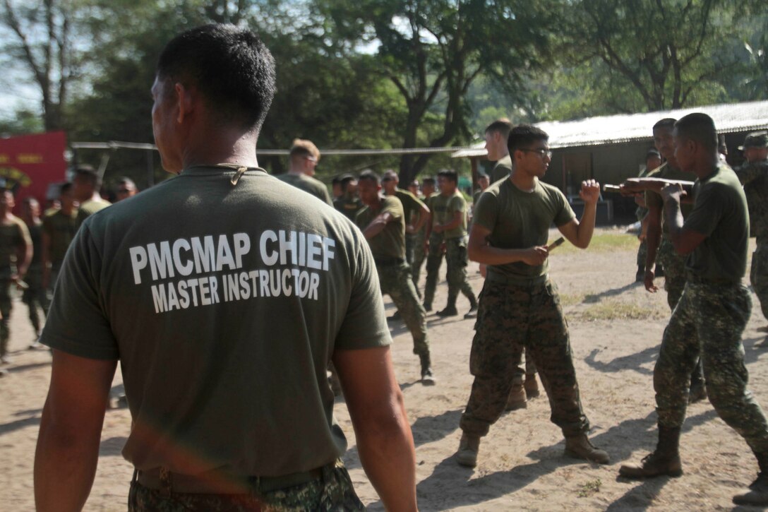 Philippine Marine Corps Martial Arts master instructor Sgt. Eddy Mendoza  oversees knife techniques during a PMCMAP course alongside U.S. Marines and sailors with Company B., Battalion Landing Team 1st Battalion, 5th Marines, 31st Marine Expeditionary Unit, as a part of exercise Balikatan 2013 in Ternate, Philippines, April 10. As treaty allies, the Armed Forces of the Philippines and U.S. military have a longstanding relationship that has contributed to regional security and stability. The 31st MEU is the only continuously forward-deployed MEU and is the Marine Corps’ force in readiness in the Asia-Pacific region.