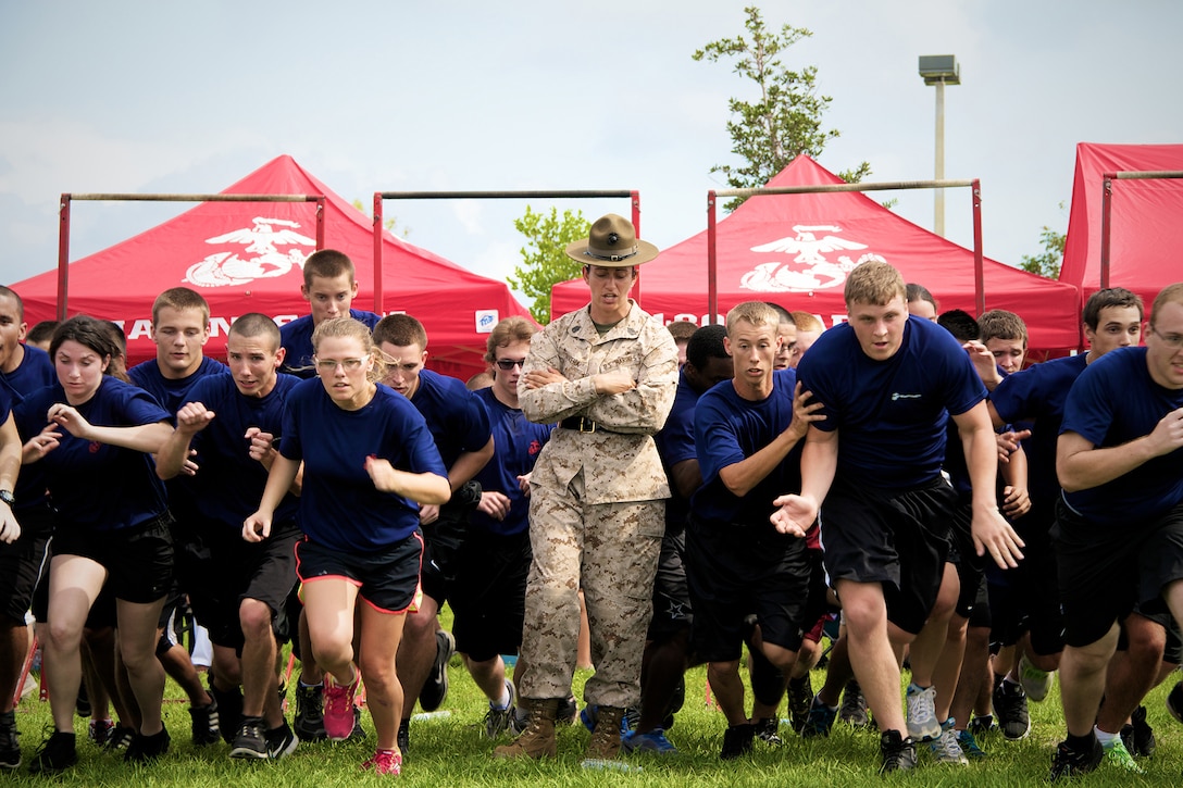 Future Marines rush to the other side of a field as a Marine Corps drill instructor counts them down from 10, during Recruiting Station Fort Lauderdale’s annual field meet April 20, 2013.  Hundreds of future Marines participated in various Marine Corps inspired competitions like squad pull ups, crunches and a knowledge test designed to give them a taste of boot camp.  