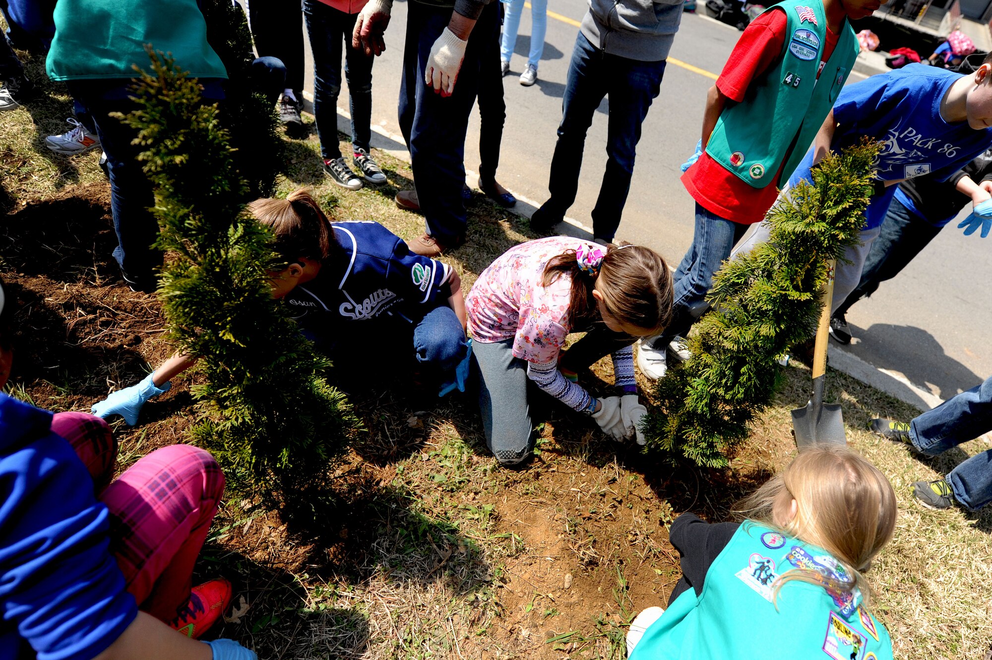 Girl Scouts from Osan Elementary School plant trees to help celebrate Earth Day at Osan Air Base, Republic of Korea, April 19, 2013. Students from the Osan American schools and Osan community members helped raise awareness for Earth Day by participating in poster contests, planting trees and pledging to help better the Earth. (U.S. Air Force photo/ Staff Sgt. Sara Csurilla) 