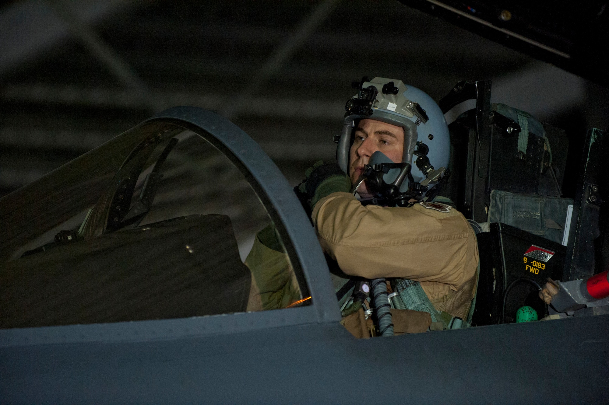 U.S. Air Force Capt. Travis Stephens, 389th Fighter Squadron assistant director of operations, adjusts his helmet at Mountain Home Air Force Base, Idaho, April 21, 2013. The 389th FS and Aircraft Maintenance Unit Airmen deployed to Southwest Asia to assist combatant commanders with combat Air Power. (U.S. Air Force photo/Staff Sgt. Roy Lynch) (Released)