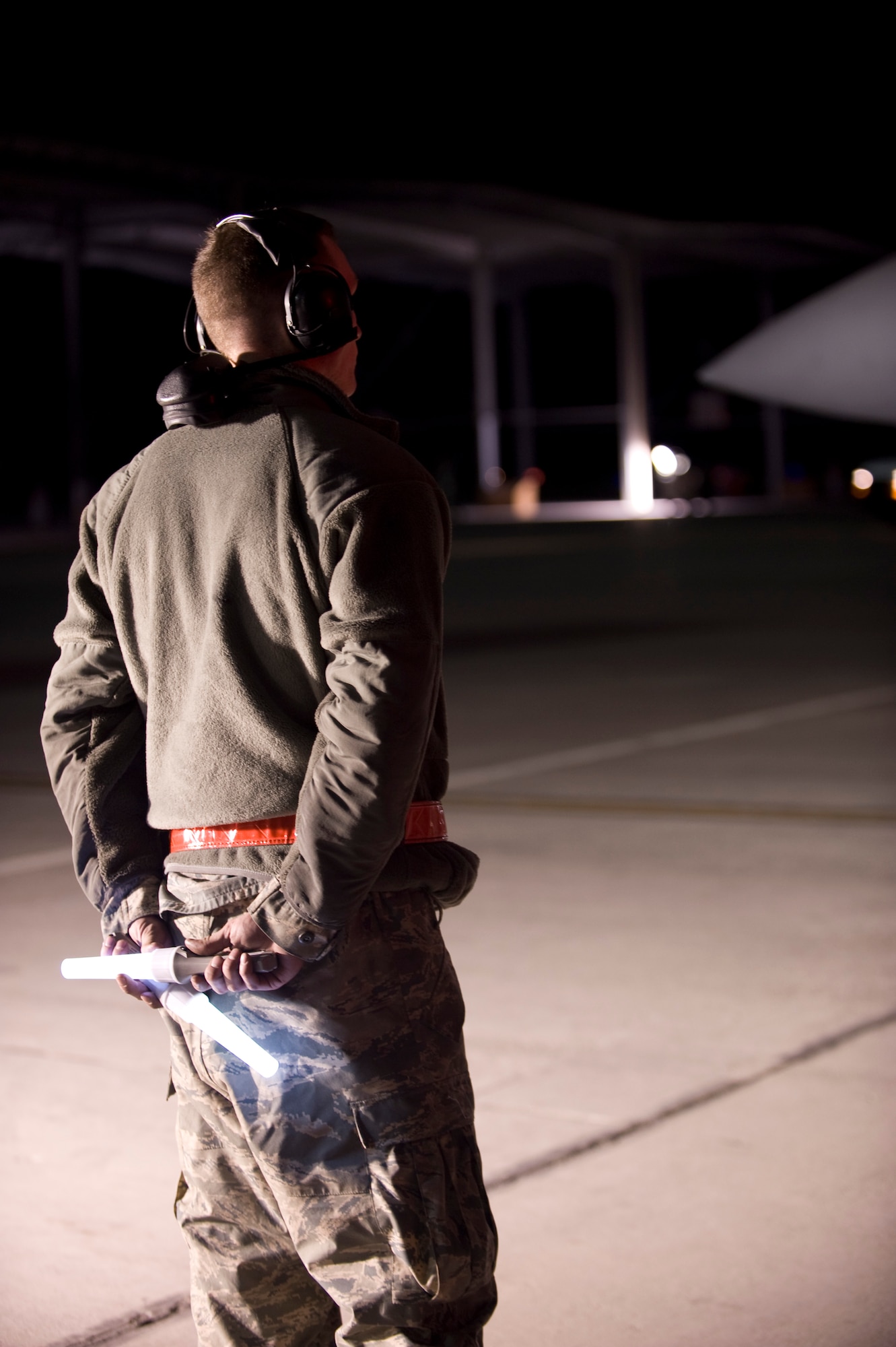 U.S. Air Force Airman 1st Class Jamie Morgan, 366th Aircraft Maintenance Squadron, gets ready to direct an F-15E Strike Eagle out of the terminal April 21, 2013 at Mountain Home Air Force Base, Idaho. Airmen in non-aviation roles will be conducting a wide range of tasks to assist F-15E crews providing close-air support capabilities in Southwest Asia. (U.S. Air Force photo/Airman 1st Class Malissa Lott) (Released)