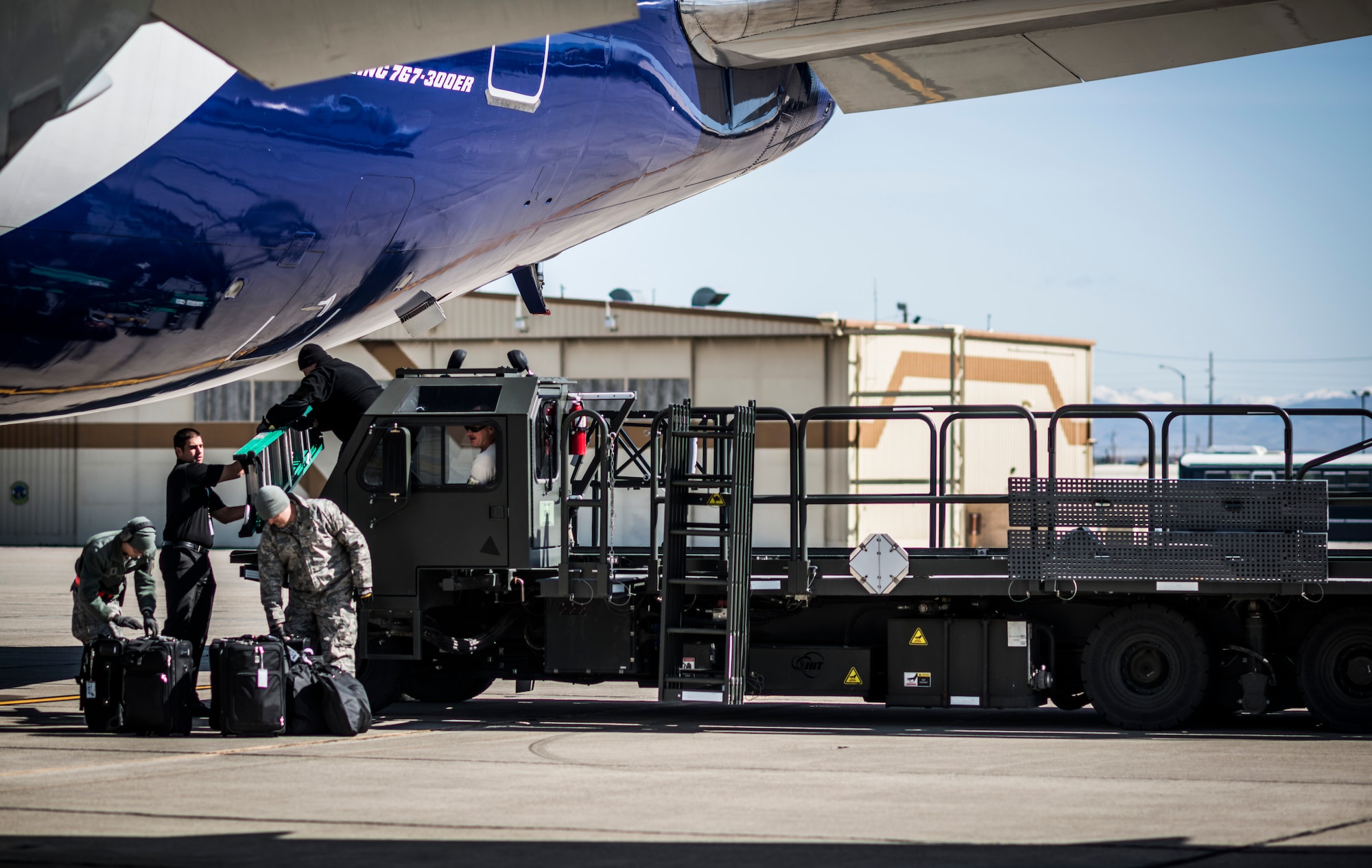 Airmen take care of the final bags to load onto an aircraft at Mountain Home Air Force Base, Idaho, April 23, 2013. The aircraft carried Airmen deploying in support of Operation Enduring Freedom. (U.S. Air Force photo/Tech. Sgt. Samuel Morse)