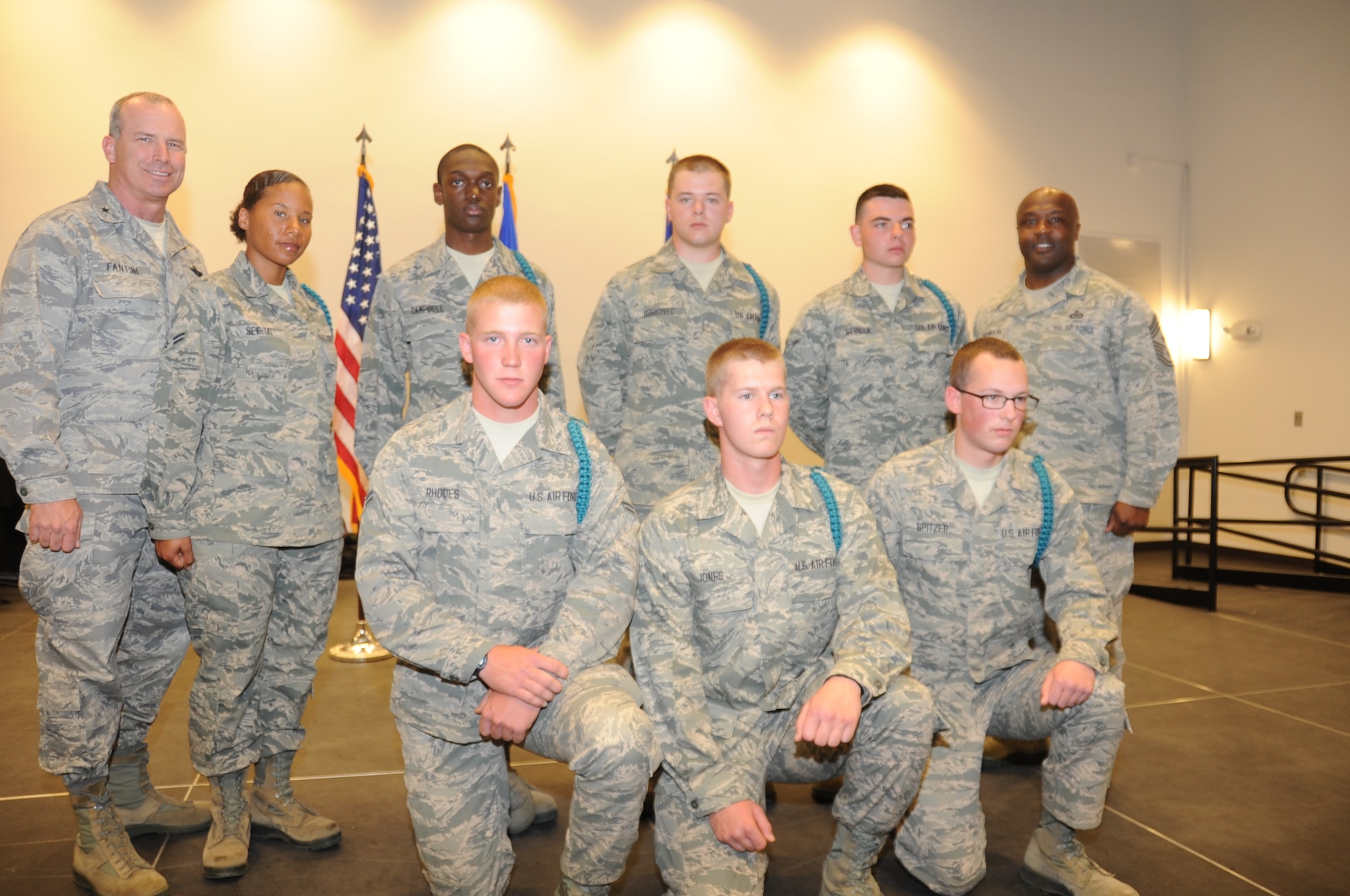 Brig. Gen. Michael Fantini and Command Chief Master Sgt. Eric Johnson pinned teal ropes onto students in the Solid Rock Cafe at Sheppard Air Force Base April 23. The Teal ropes represent individuals that will serve in leadership positions to supplement the SASH program. (U.S. Air Force photo by Airman 1st Class Jelani Gibson) 