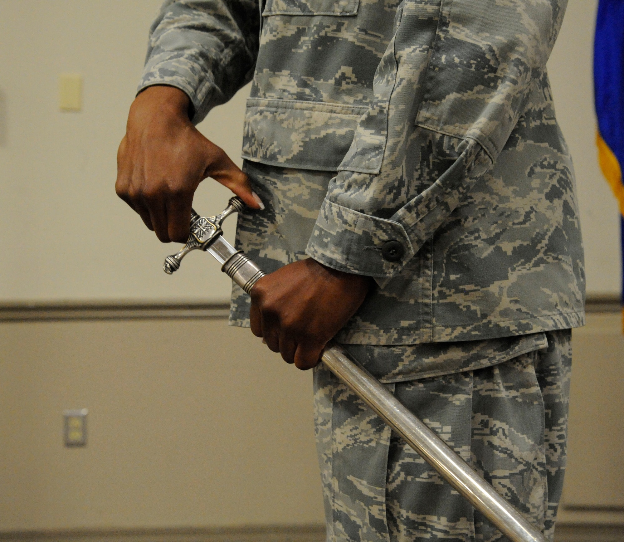 Senior Airman Khrystyna Welch, 2nd Security Forces Squadron, draws her saber during saber cordon training as part of her duties on the Honor Guard on Barksdale Air Force Base, La., April 23, 2013. Airmen walk under a saber cordon during promotion ceremonies to signify the transition of junior Airmen entering the NCO ranks and NCOs entering the senior NCO ranks. It is also used to recognize winners and nominees for awards. (U.S. Air Force photo/Airman 1st Class Andrew Moua)