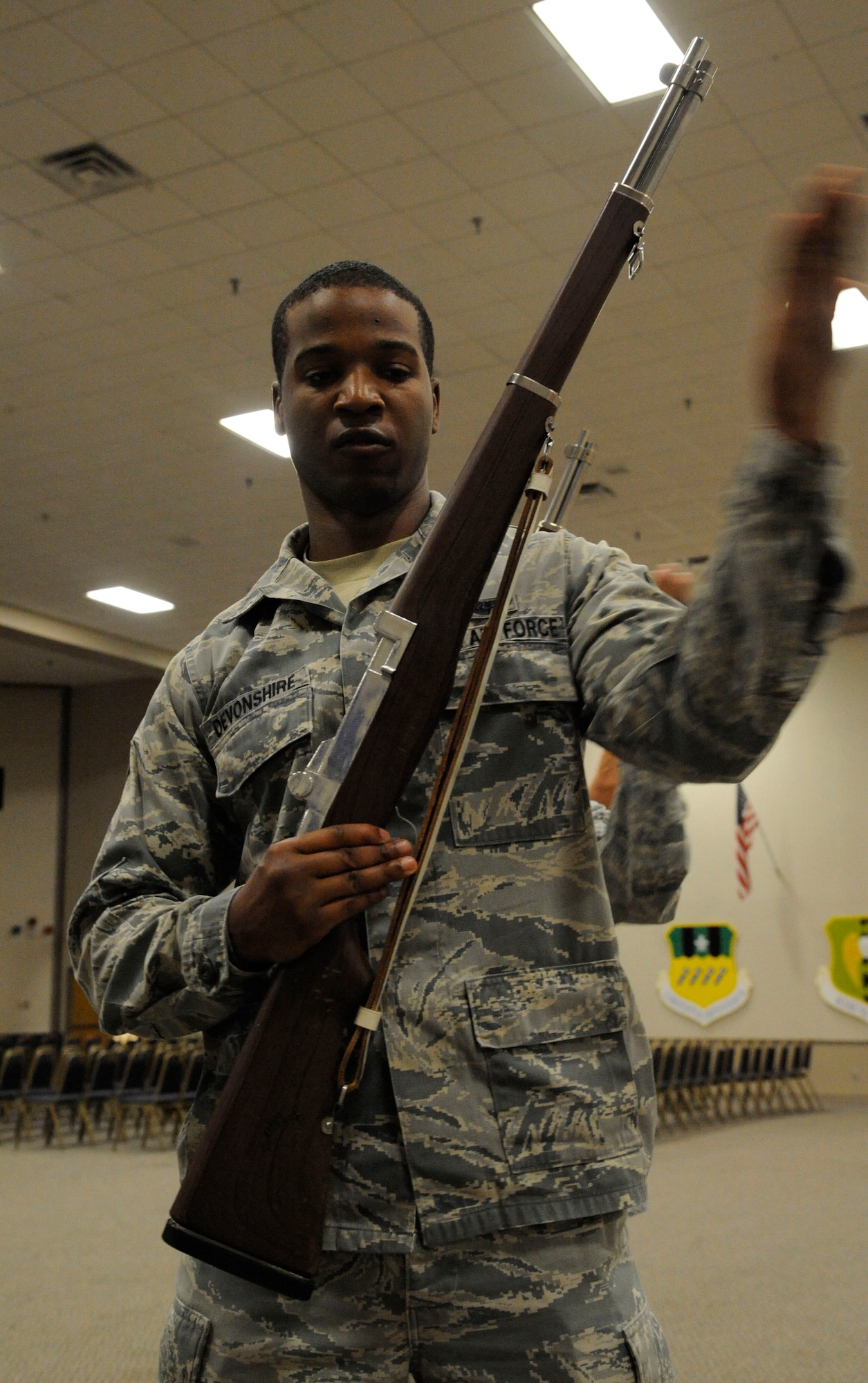 Senior Airman Larry Devonshire, 11th Bomb Squadron, practices a three-volley salute on Barksdale Air Force Base, La., April 23, 2013. A tradition which dates back to the European dynastic wars, where fighting ceased to collect the dead, and three shots were fired which signaled the battle could resume. (U.S. Air Force photo/Airman 1st Class Andrew Moua)