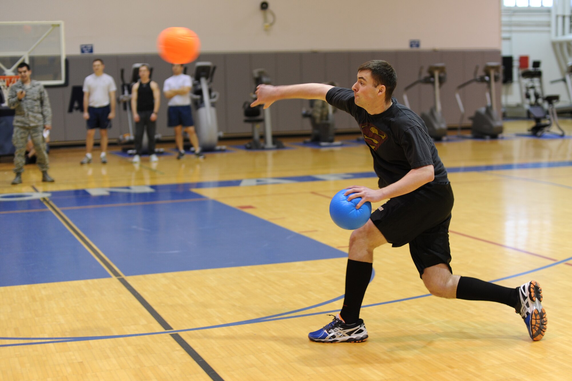 U.S. Air Force Airman Devan Downey, 354th Communications Squadron network administrator, throws a dodgeball during a Sexual Assault Awareness Month dodgeball tournament April 18, 2013, Eielson Air Force Base, Alaska. SAAM highlights sexual violence as a major public health, human rights and social justice issue and reinforces the need for prevention efforts. (U.S. Air Force photo by Staff Sgt. Jim Araos/Released)
