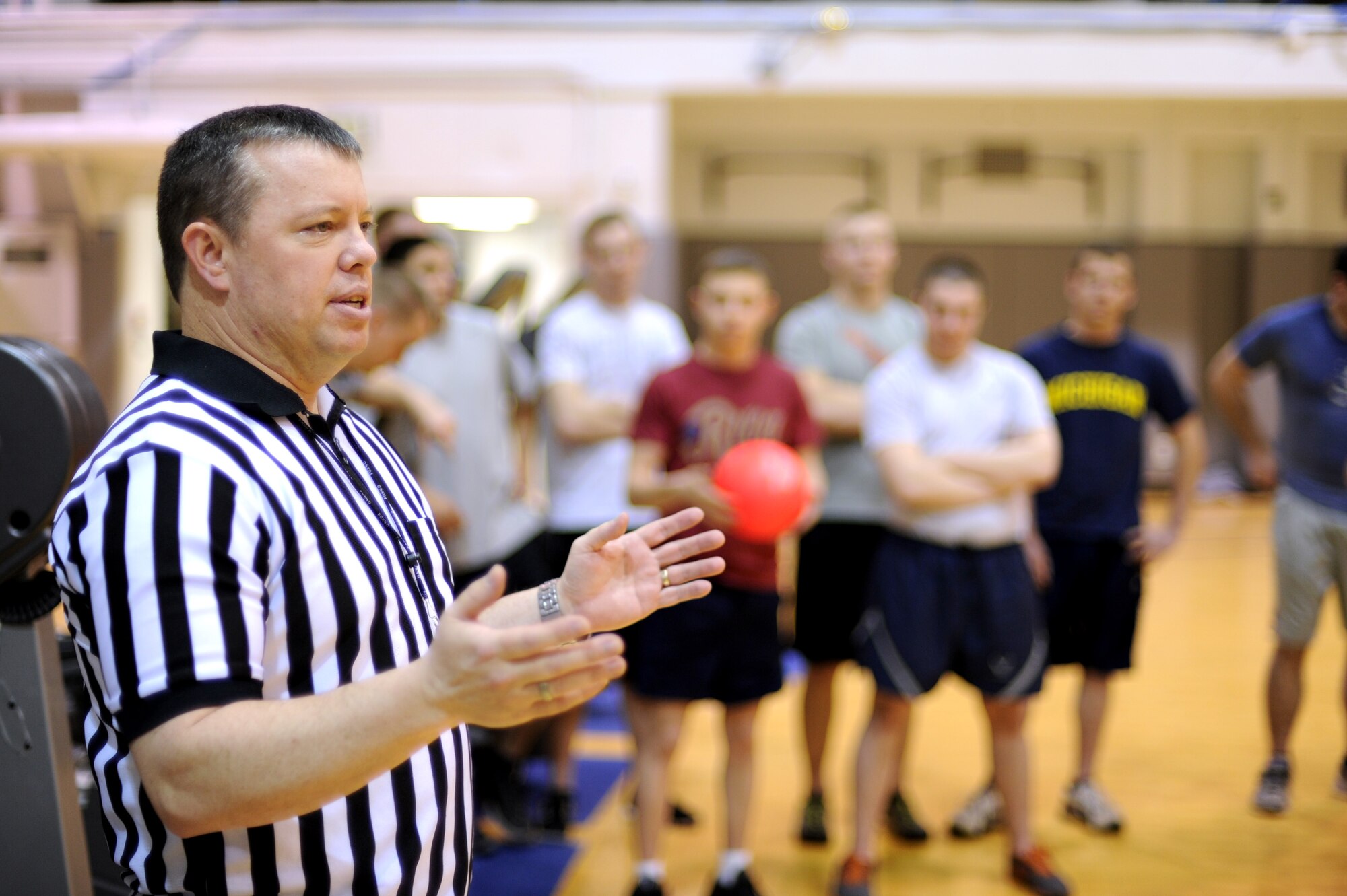 U.S. Air Force Master Sgt. Gary Lutz, Sexual Assault Prevention and Response victim advocate, dictates game rules as referee during a Sexual Assault Awareness Month dodgeball tournament April 18, 2013, Eielson Air Force Base, Alaska. The goal of the event was to raise public awareness about sexual violence and to educate personnel and individuals on how to prevent sexual violence. (U.S. Air Force photo by Staff Sgt. Jim Araos/Released)