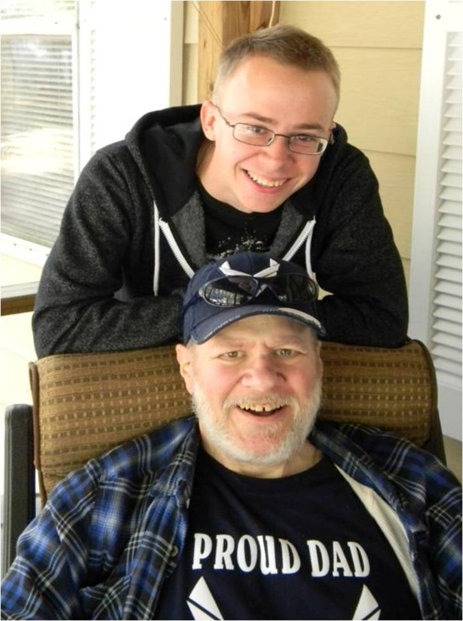 Airman 1st Class Kirk Shultz, 436th Operations Support Squadron aircrew flight equipment technician, poses with father mid April 2012 at his aunt’s vacation house in Lincoln Del. Shultz was on leave after completing technical school. (Courtesy photo)
