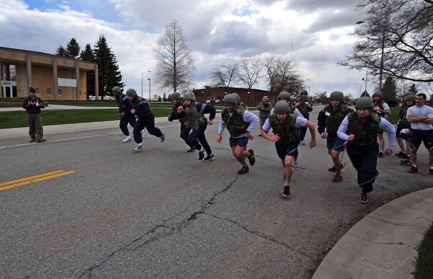 Airmen participating in the Ability to Survive and Operate Olympics begin a relay at Fairchild Air Force Base, Wash., April 16, 2013. ATSO training prepares Airmen to maintain readiness in the event of a chemical, biological, nuclear or high explosive attack. (U.S. Air Force photo by Senior Airman Taylor Curry)