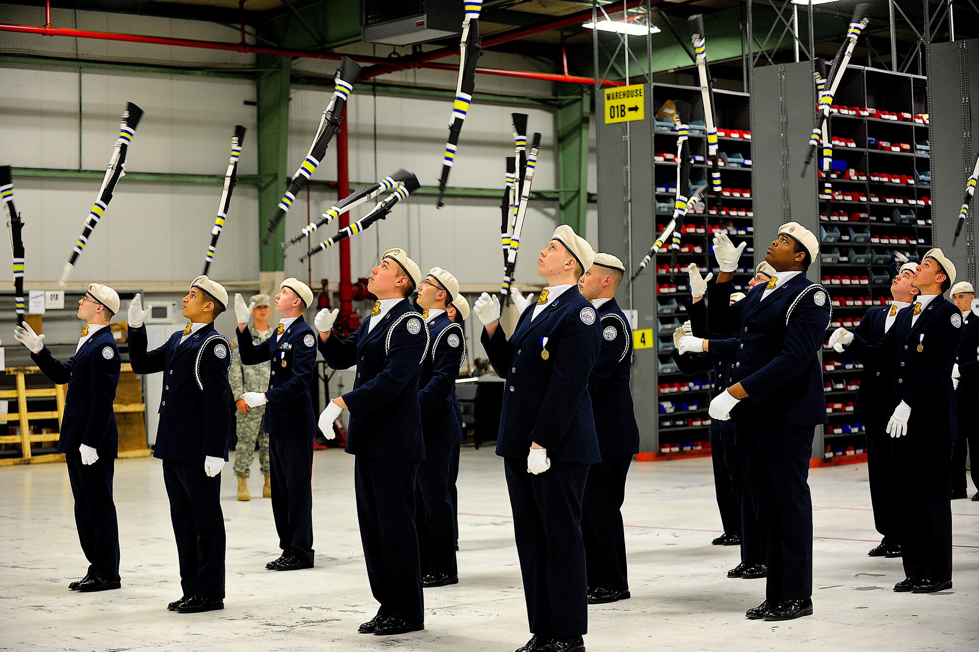 Students from Caesar Rodney High School in Camden, Del., perform in the armed exhibition during the 2013 Eagle Classic Delaware State Military Drill Championship April 20, 2013, at the 436th Logistics Readiness Squadron warehouse on Dover Air Force Base, Del. Caesar Rodney took home first place. (U.S. Air Force photo/Airman 1st Class Ashlin Federick)
