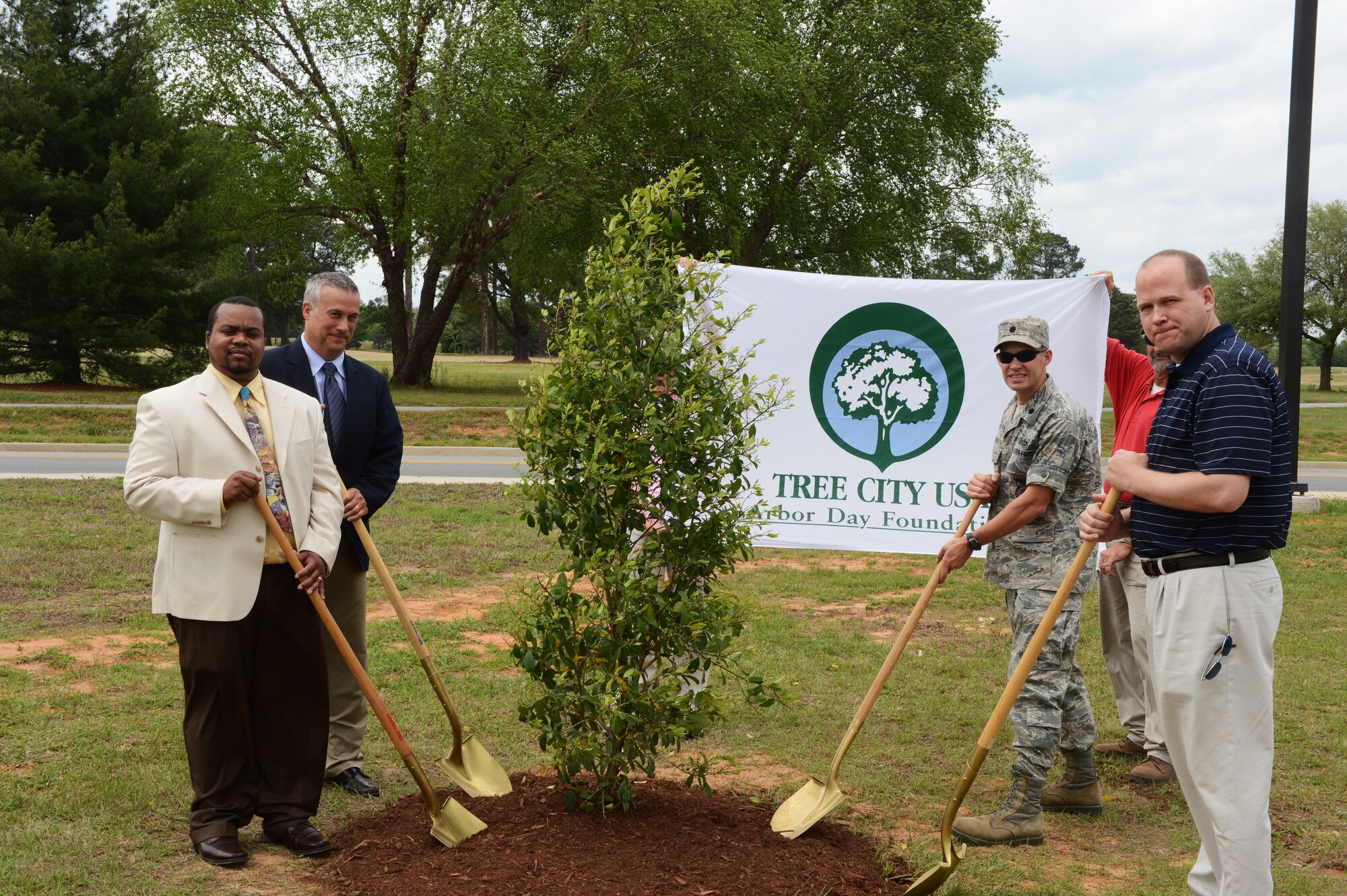 (From left) Henry Morris, 20th Civil Engineer Squadron base forester, Lowe Sharp, South Carolina Forestry Commission urban forester, Lt. Col. Terrence Walter, 20th CES commander and Chris Aamold, 20th CES deputy commander dedicate a tree at Shaw Air Force Base, S.C., April 19, 2013. The dedication ceremony was held in honor of Arbor Day, a national holiday since April 10, 1872, initiated by Julius Sterling Morton, President Grover Cleveland’s (1893-1897) secretary of agriculture. The holiday honors the significances of trees in our lives and communities and encourages the planting of new trees. Trees provide shade and shelter; reduce global warming by reducing carbon monoxide in the atmosphere, clean the air we breathe and are often used to beautify landscapes. (U.S. Air Force photo by Airman 1st Class Daniel Blackwell/Released)