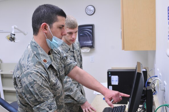 YOUNGSTOWN AIR RESERVE STATION, Ohio -- U.S. Air Force Reserve Maj. Christopher Francese, a dentist with the 910th Medical Squadron, reviews dental X-rays with Senior Airman Jarrad Griffith, here April 6, 2013. Dental check-ups are available for personnel during Unit Training Assemblies. (U.S. Air Force photo/Senior Airman Ron Dombkowski)