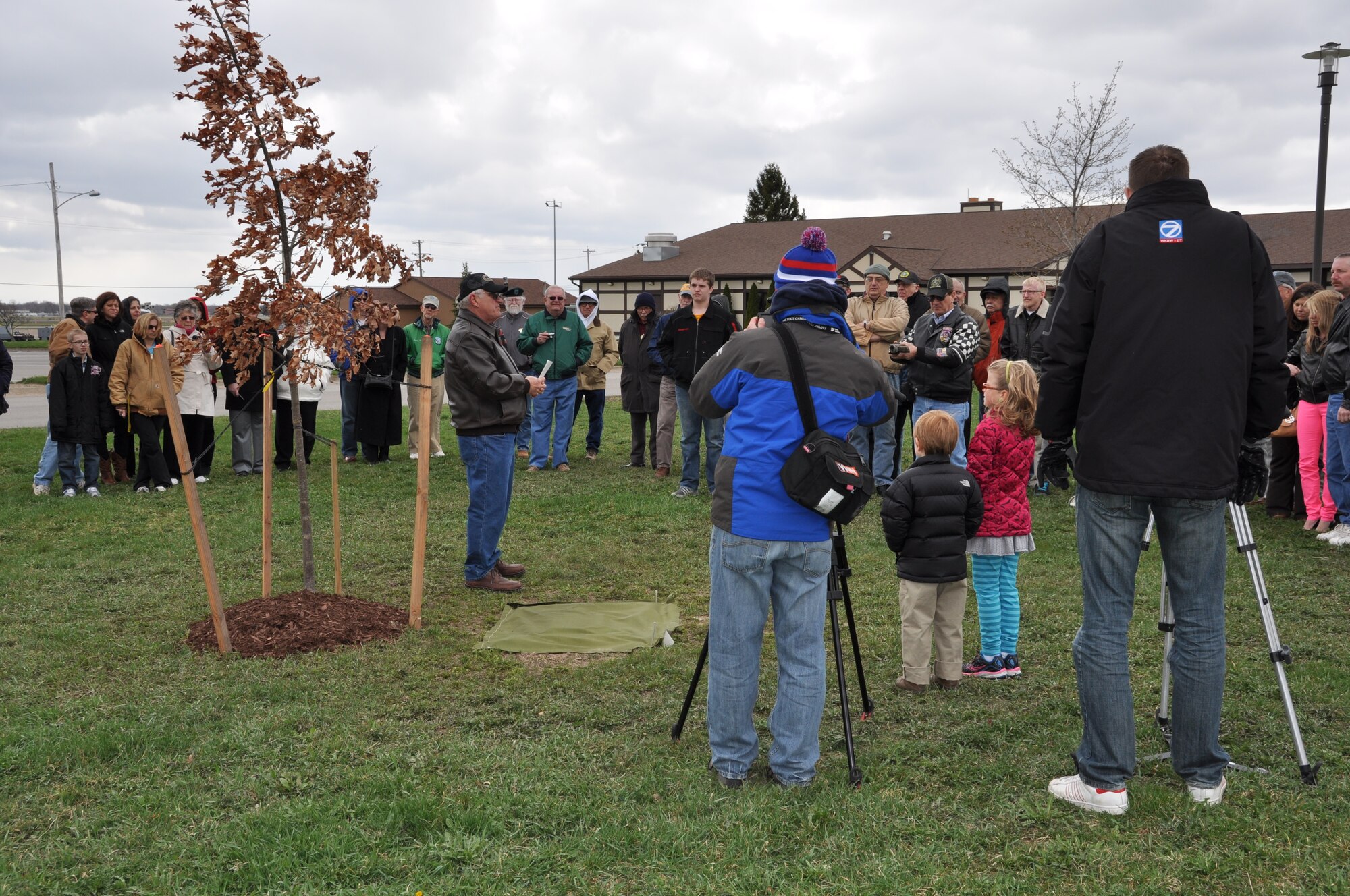 Members of the 3rd Battalion, 19th Special Forces Group and their families gather together April 20 at the Niagara Falls Air Reserve Station, N.Y. to take part in a tree dedication ceremony in honor of the unit.  A plaque was placed at the foot of the tree to recognize the green berets who participated with the 914th Airlift Wing and the 42nd Aviation Battalion in 55 airborne missions from 1968 to 1975.  (U.S. Air Force photo by Master Sgt. Kevin Nichols)