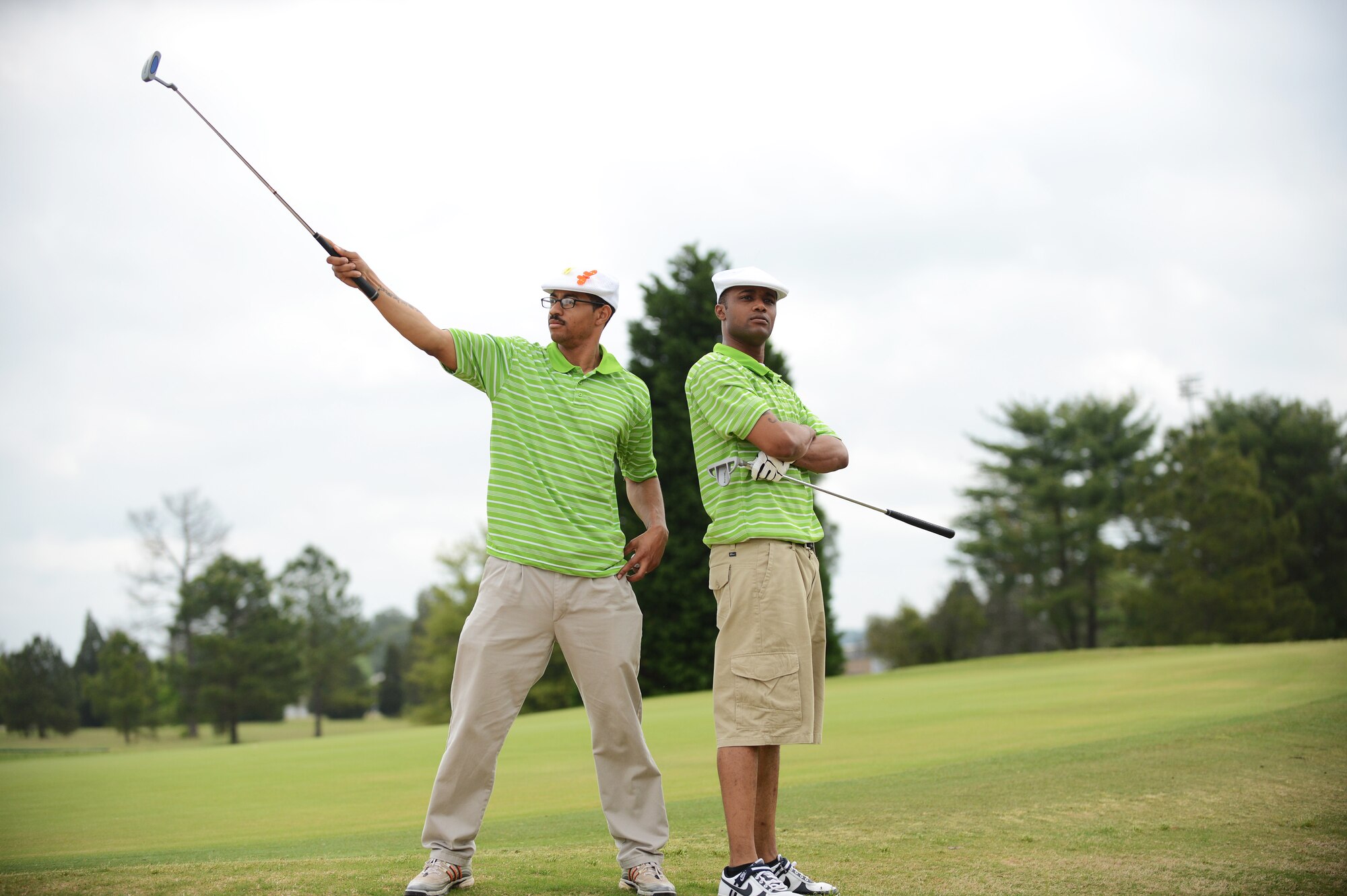 Senior Airman Alexander Aldridge (left), 20th Logistics Readiness Squadron vehicle operator, and Senior Airman Michael Scott 20th LRS vehicle operator pose after completing a hole during the “5th Annual John K. Crosswell Charity Golf Tournament” held at Shaw Air Force Base, S.C., April 19, 2013. The tournament was held to raise money for the Crosswell organization whose goal is to provide a loving, nurturing environment for children and families in need. All the proceeds from the event went to further this cause. (U.S. Air Force photo by Airman 1st Class Daniel Blackwell/Released)