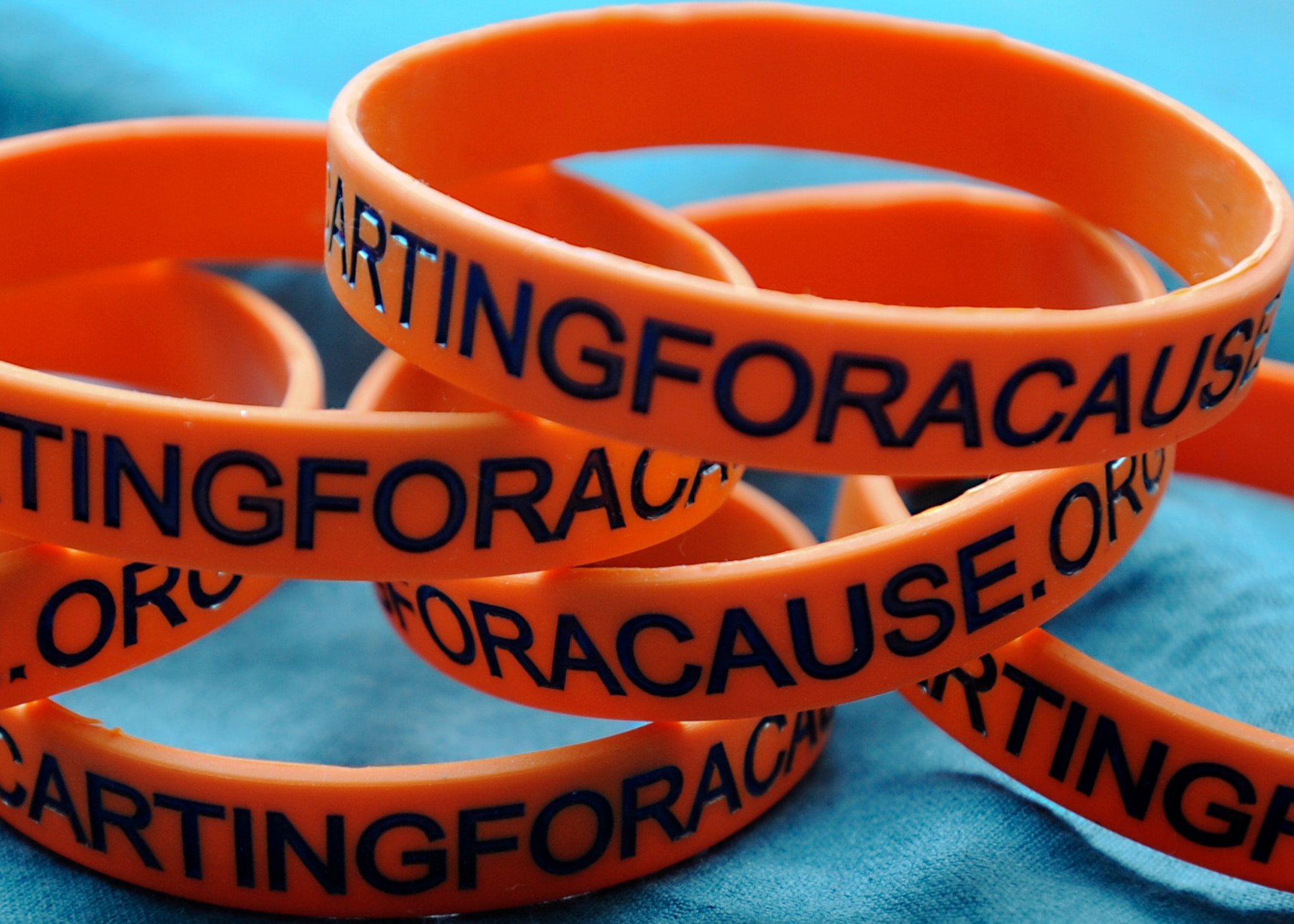 These wristbands represent the cross-country venture program, GO CARTS, which was created by Ray Rehbereg, a current Coast Guard chief electricians mate. The program’s volunteers are set to drive an electric-powered golf cart thousands of miles across more than 10 states, all in an effort to raise awareness for the Wounded Warrior Project. (U.S. Air Force photo by Airman 1st Class Kimberly Nagle/Released)
