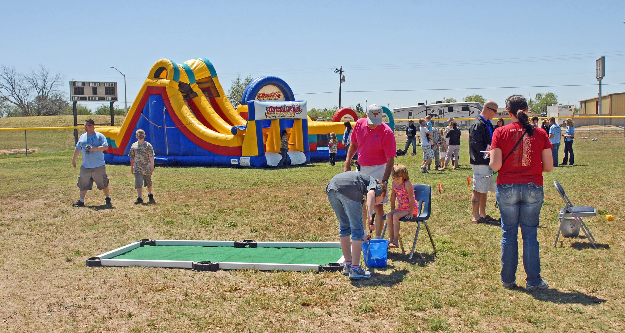 GOODFELLOW AIR FORCE BASE, Texas—Goodfellow families participate in Children’s Fest, at the Youth Center baseball field, here, April 20. This year’s Children’s Fest included a bounce house, numerous games and a special visit from Sparky, the Fire Dog. (U.S. Air Force photo/1st Lt. Leanne Hedgepeth)