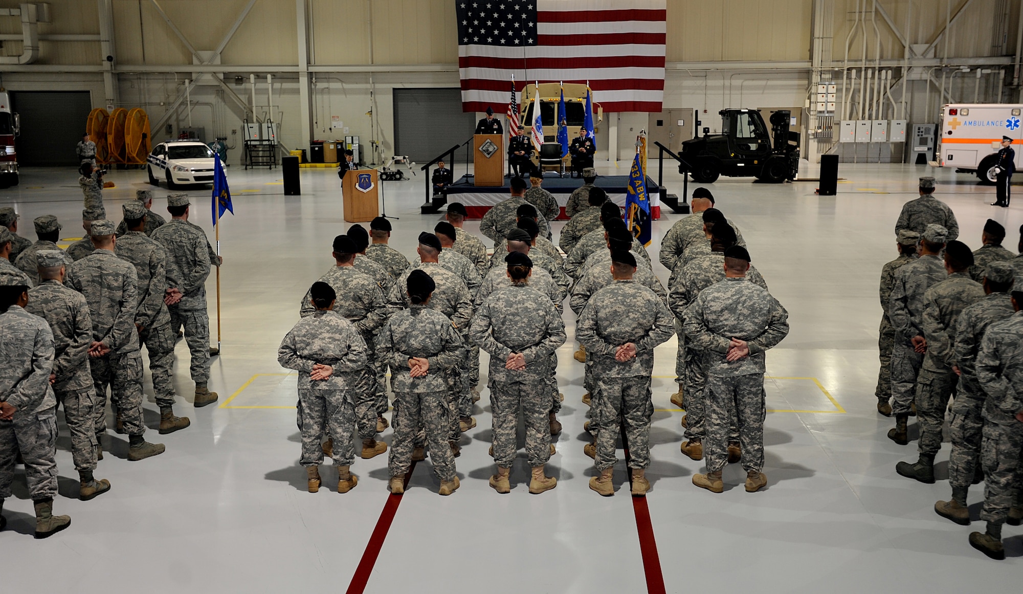 Soldiers and Airmen from the 633rd Air Base Wing stand in formation during a change of command ceremony at Langley Air Force Base, Va., April 22, 2013. The formations gave a last farewell salute to the old commander, and the first welcoming salute to the new commander. (U.S. Air Force photo by Airman 1st Class Kimberly Nagle/Released)