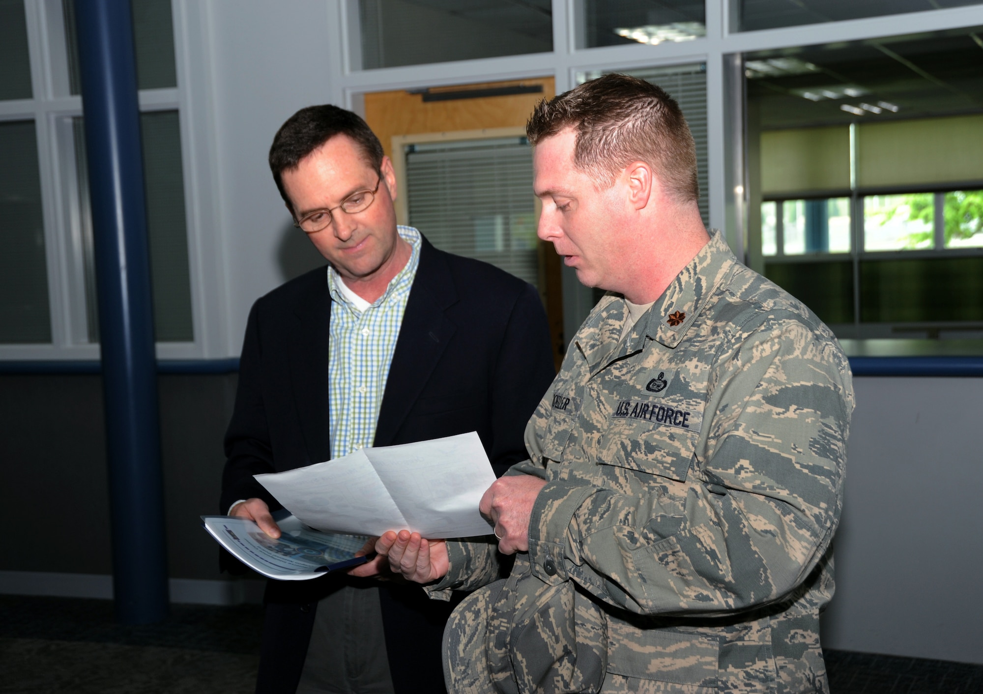 Air Force Maj. Brian Kroeller (right), 142nd Fighter Wing, briefs a new joint training site proposal to Lt. Gen. Joseph L. Lengyel (left), Vice Chief, National Guard Bureau, during his visit to the Portland Air National Guard Base, Portland, Ore., April 18, 2013. (Air National Guard photo by Air Force Tech. Sgt. John Hughel, 142nd Public Affairs)