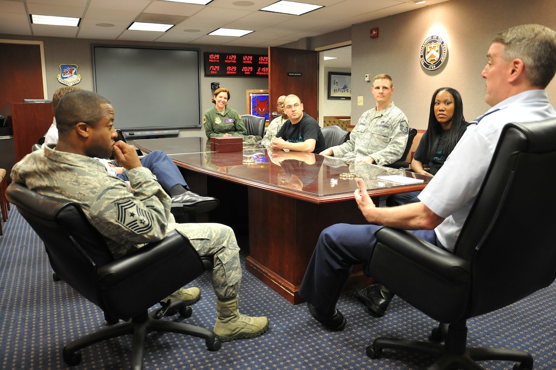 U.S. Air Force Col. Mike Minihan, right, commander of the 89th Airlift Wing, and Chief Master Sgt. Eddie Webb, 89th AW command chief, discuss sexual assault prevention with victim advocates April 17 at Joint Base Andrews.  Face-to-face engagement and continued engagement with Airmen is crucial to eliminating sexual assault, said Minihan. (U.S. Air Force photo by Maj Joel Harper)