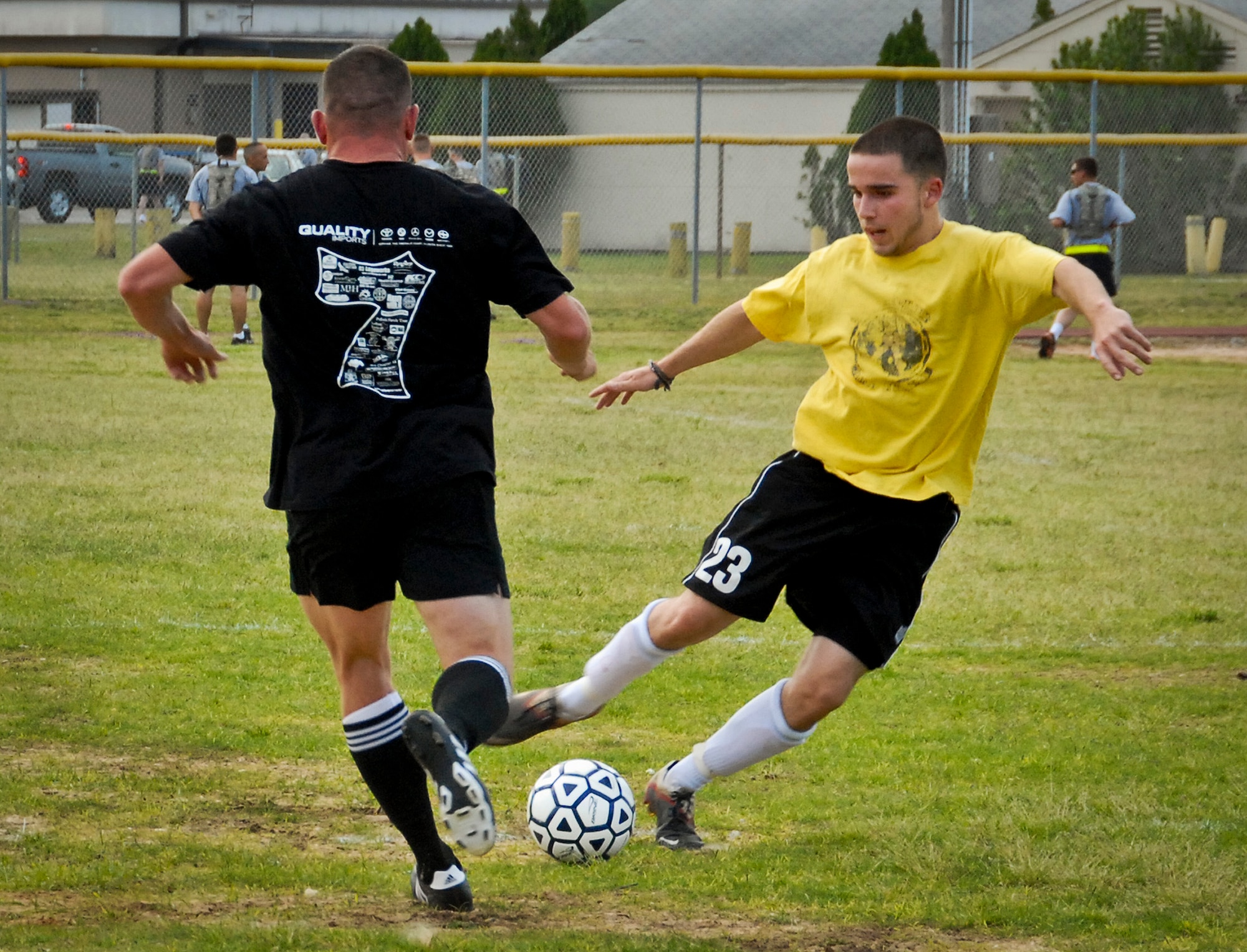 Kyle Hail, a member of the 780th Test Squadron intramural soccer team, maneuvers the ball past a 379th Training Squadron defender during the first game of the season April 22 at Eglin Air Force Base, Fla.  Hail’s four goals helped the 780th shut out the 379th, 9-0.  (U.S. Air Force photo/Kevin Gaddie) 