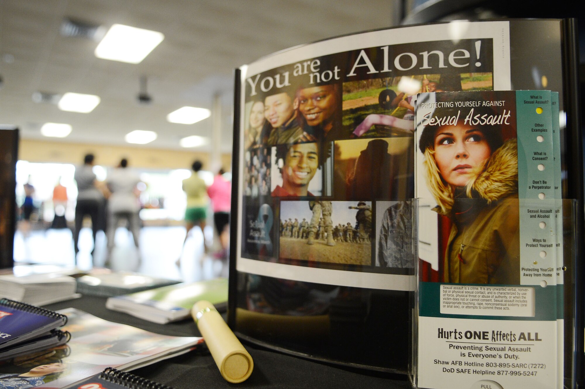 Sexual Assault Response Program flyers are displayed on a table during a self defense class at the Fitness Center, Shaw Air Force Base, S.C., April 19, 2013.  U.S. Air Force Master Sgt. Jamey Olsen, U.S. Air Forces Central Command mechanical subject matter expert, taught 32 females different escape techniques during a self defense class.  The class is held annually by the SARP during April for Sexual Awareness month. (U.S. Air Force photo by Airman 1st Class Nicole Sikorski/Released)