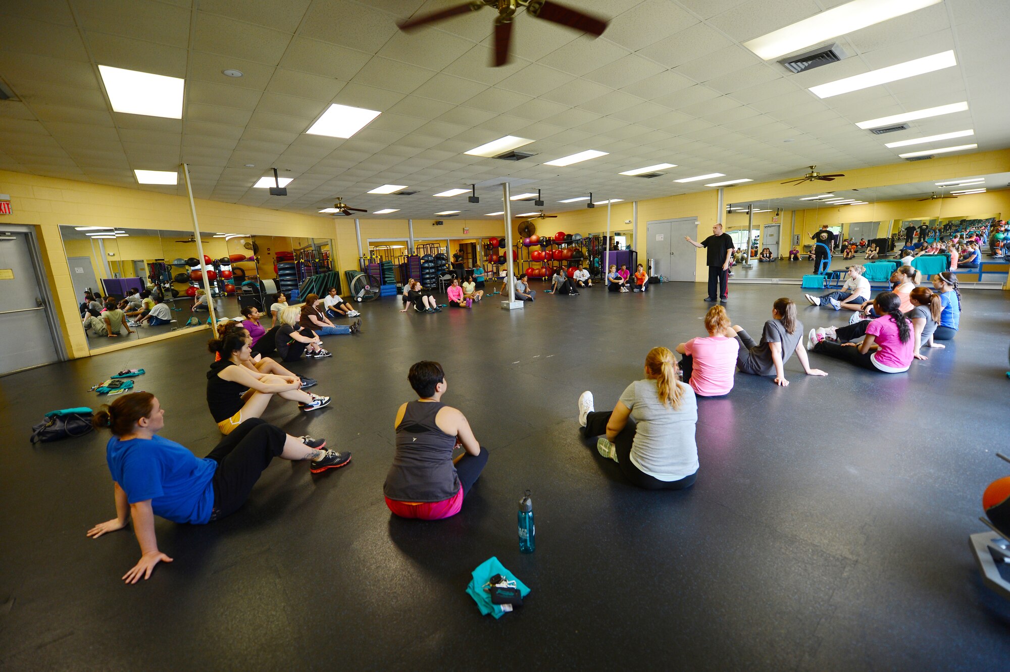 U.S. Air Force Master Sgt. Jamey Olsen,  U.S. Air Forces Central Command mechanical subject matter expert teaches 32 females different escape techniques during a self defense class at the Fitness Center, Shaw Air Force Base, S.C., April 19, 2013.  The class is held annually by the Sexual Assault Response Program during April for Sexual Awareness month. (U.S. Air Force photo by Airman 1st Class Nicole Sikorski/Released)
