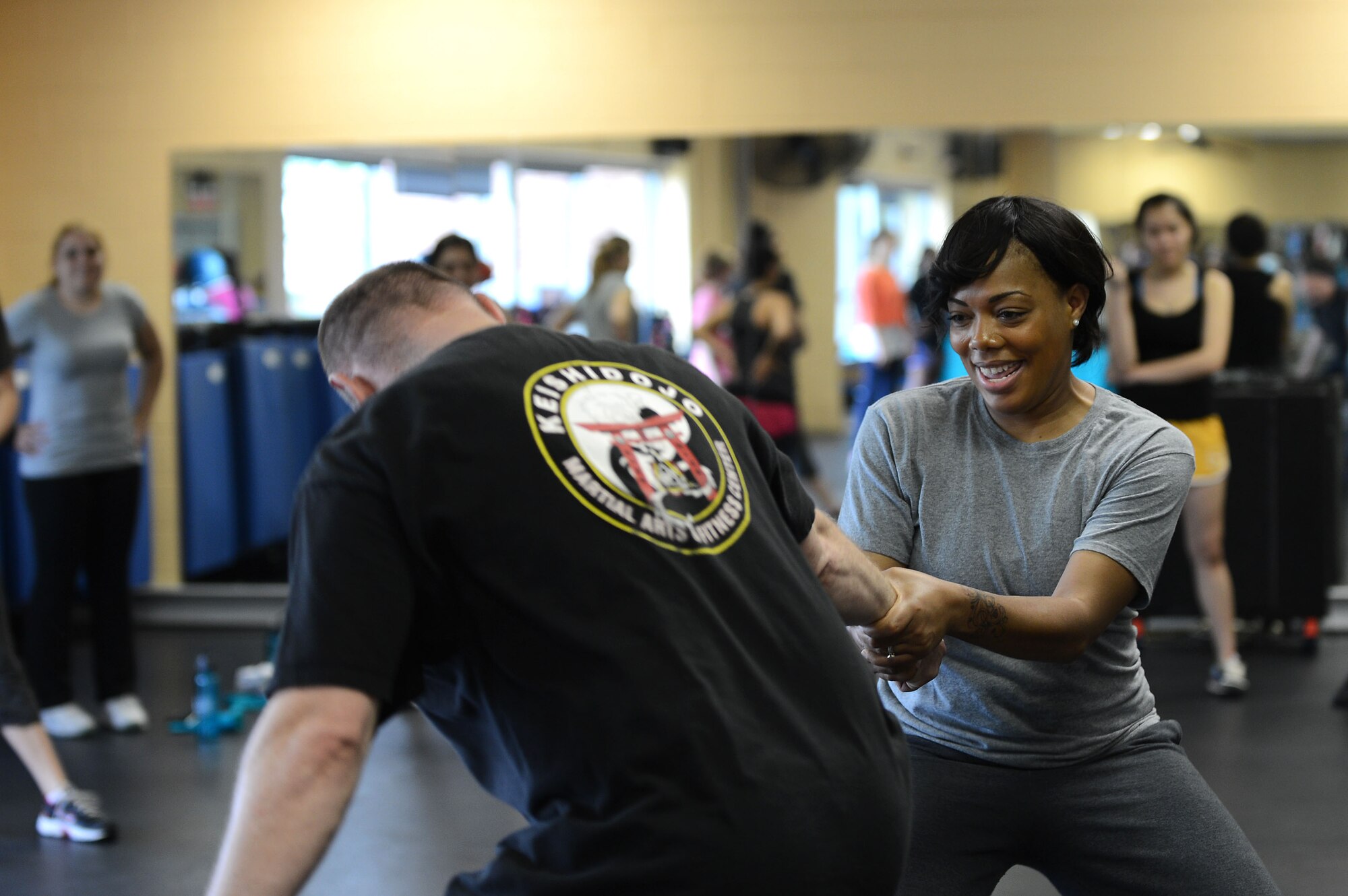 U.S. Air Force Tech. Sgt. Amber Bailey, 9th Air Force commander executive assistant, practices escape techniques with U.S. Air Force Master Sgt. Jamey Olsen, U.S. Air Forces Central Command mechanical subject matter expert, at the Fitness Center, Shaw Air Force Base, S.C., April 19, 2013.  Olsen taught 32 females different escape techniques during a self defense class.  The class is held annually by the Sexual Assault Response Program during April for Sexual Awareness month. (U.S. Air Force photo by Airman 1st Class Nicole Sikorski/Released)


