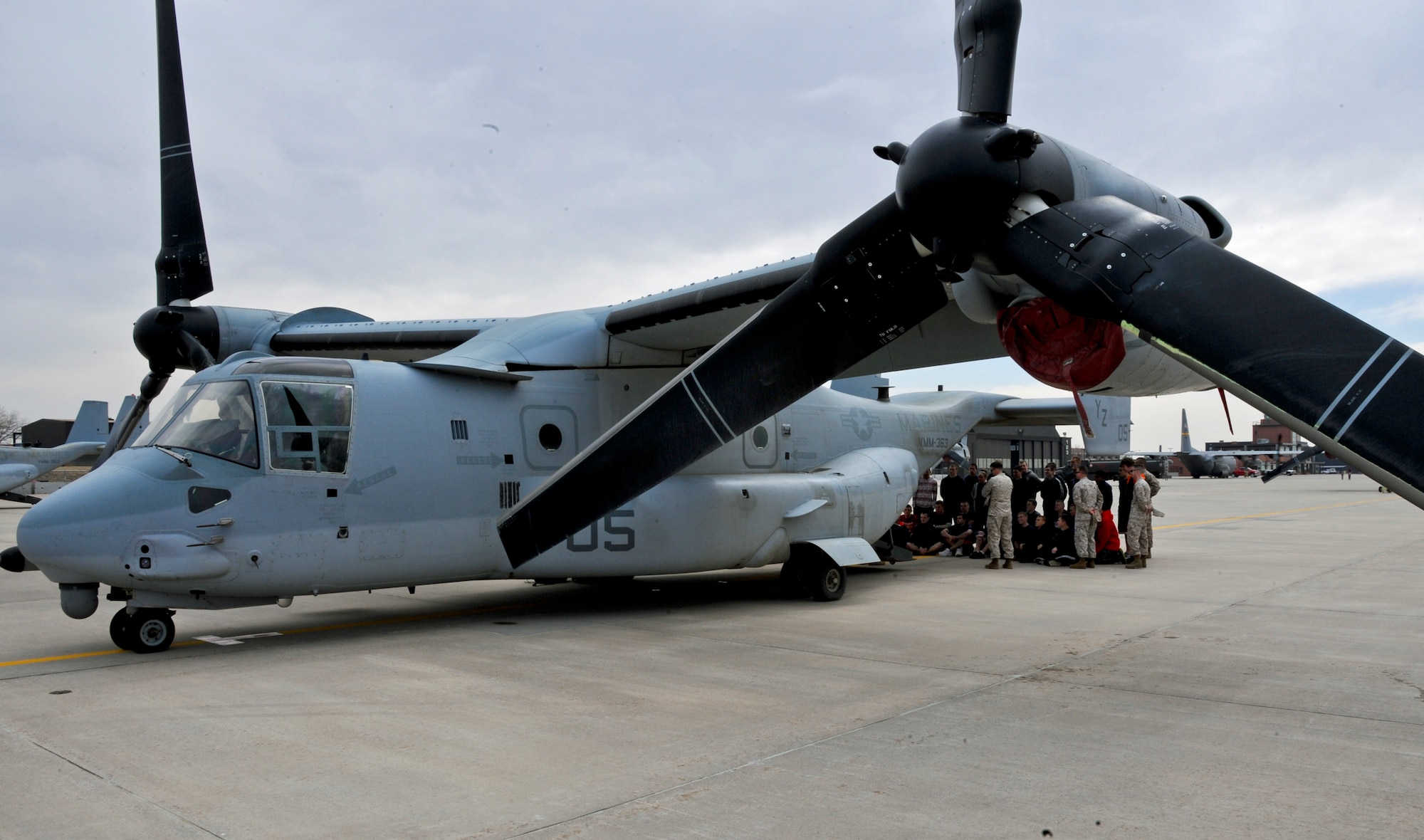 PETERSON AIR FORCE BASE, Colo. -- Members of the Marine Medium Tiltrotor Squadron 363, stationed at Marine Corps Air Station Miramar, Calif., show delayed-entry Marine recruits from an area recruiting substation the MV-22 Osprey aircraft they operate April 13. The Marines from VMM-363 flew out of Peterson AFB and conducted routine high-altitude training exercises April 9-18 at Fort Carson training areas. (U.S. Air Force photo/Airman Jacob Morgan)