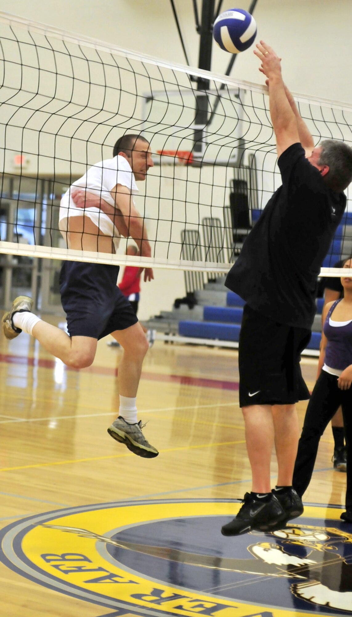 Michael Chapman, 736th Aircraft Maintenance Squadron, slams home a kill as a 436th Logistics Readiness Squadron defender attempts to block during an intramural volleyball game April 22, 2013, at the fitness center on Dover Air Force Base, Del. The 736th AMXS defeated the 436th LRS 25-22 and 25-21. (U.S. Air Force photo/Tech. Sgt. Chuck Walker)