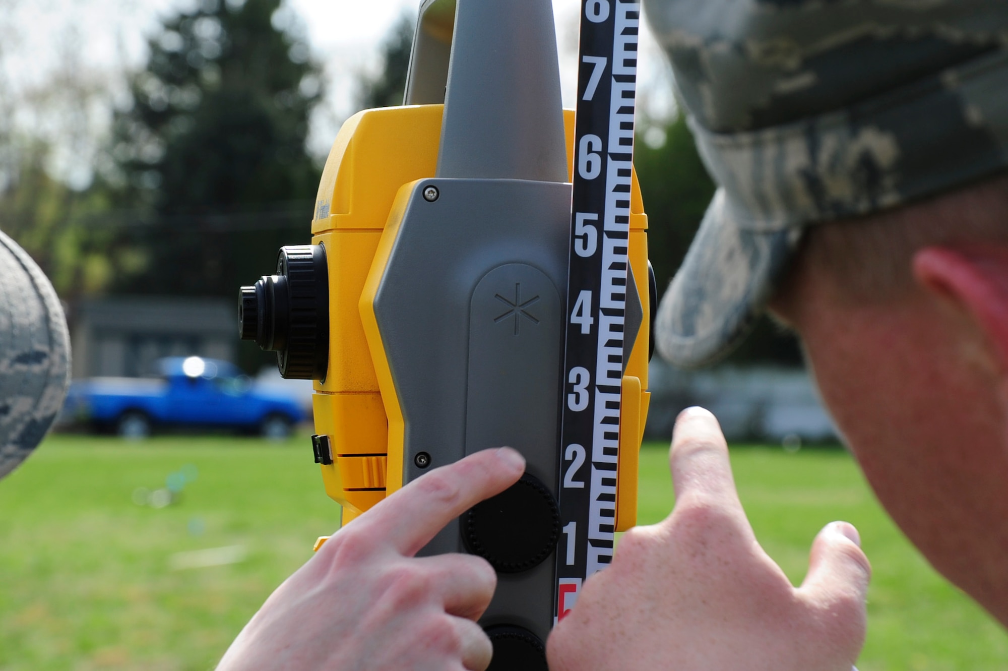 Members of the 436th Engineer Squadron Engineering Flight ensure the height of equipment is precise to ensure standardize of the measurements at the mock crash grid survey, April 17, 2013, at Dover Del. The training is part of their mandatory annual requirement.  (U.S. Air Force photo/Senior Airman Jared Duhon)