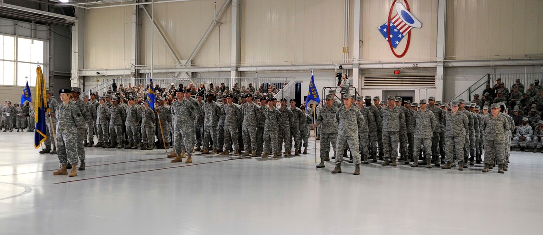 Airmen and Soldiers stand in formation during the 633rd Air Base Wing change of command ceremony at Langley Air Force Base, Va., April 22, 2013. Col. John J. Allen Jr succeeded Col. Korvin D. Auch as commander of the wing. (U.S. Air Force photo by Staff Sgt. Dana Hill/Released)
