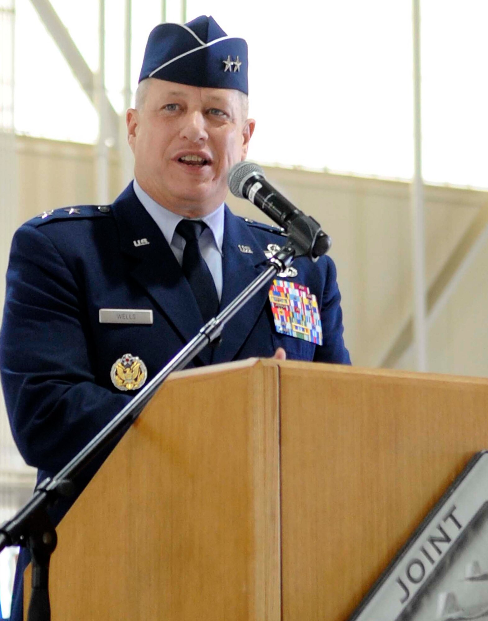 Maj. Gen Lawrence Wells, 9th Air Force commander, addresses the audience during a change of command ceremony at Langley Air Force Base, Va., April 22, 2013. Col. Korvin D. Auch relinquished command of the 633rd Air Base Wing to Col. John J. Allen Jr. (U.S. Air Force photo by Staff Sgt. Dana Hill/Released)