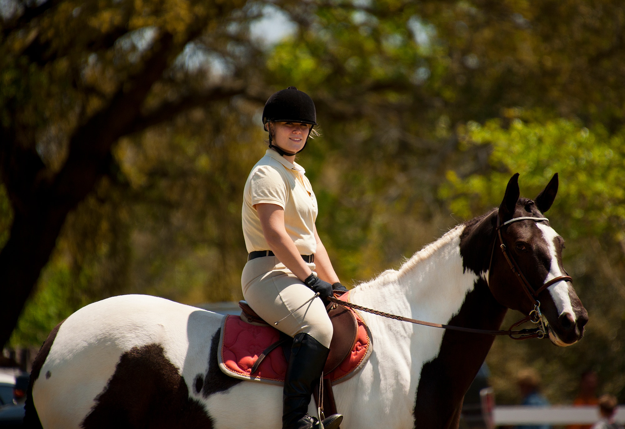 A rider waits for her turn in the demonstration ring during the Sand and Spur Riding Club open house event April 20 at Eglin Air Force Base, Fla.  The club provided pony rides for kids and riding and training demonstrations. Those who attended got an up close and hands-on experience with many of the different breeds of horses housed at the stables on base.  (U.S. Air Force photo/Samuel King Jr.)