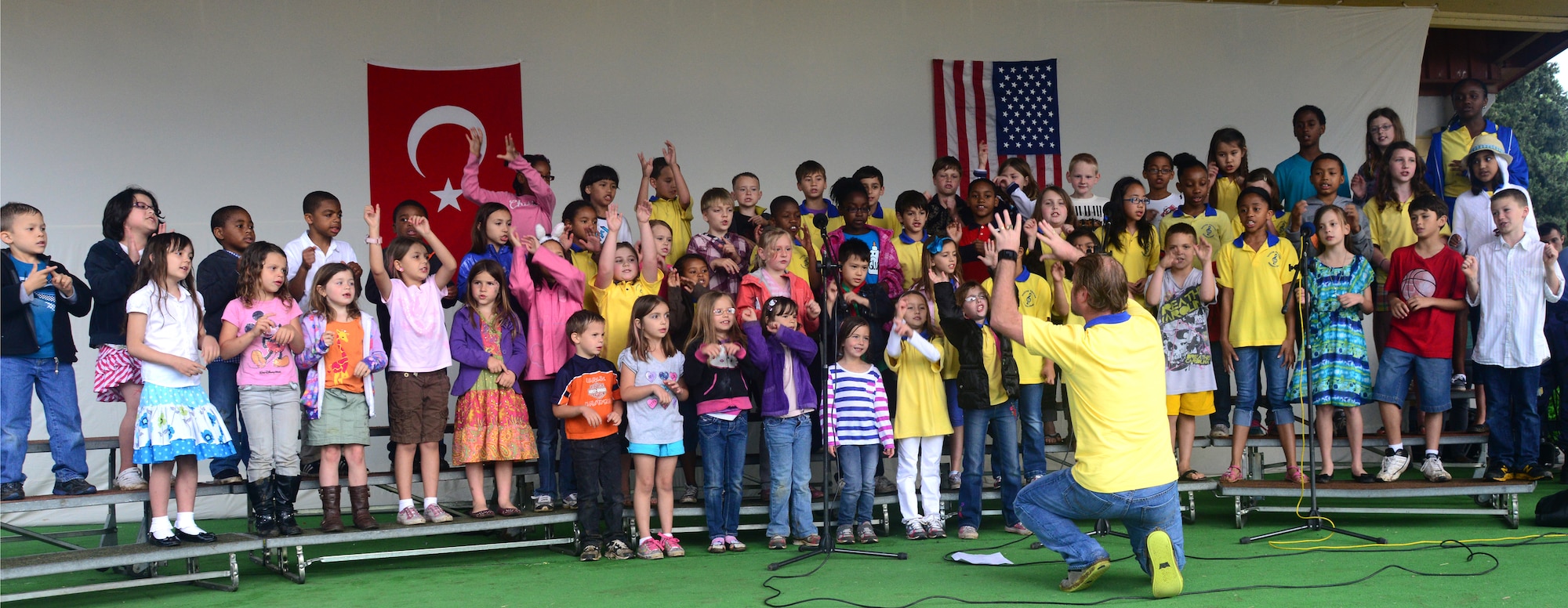 Members of the Incirlik Unit School Choir perform for audience members attending the Children’s Day Festival April 21, 2013, at Arkadas Park, Incirlik Air Base, Turkey. The event offered an opportunity for camaraderie and building partnership between Turkish and American service members and civilians. The event featured activity booths, games and performances designed to honor children and celebrate cultures coming together. (U.S. Air Force photo by Staff Sgt. Eric Summers Jr./Released)